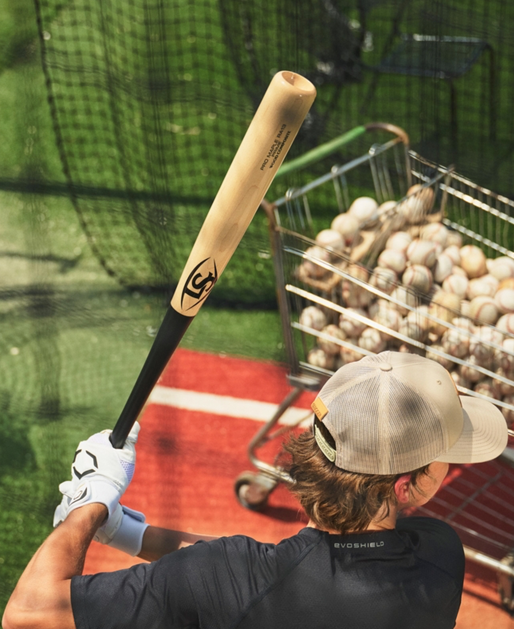 Player practicing with the RA13 Pro Prime Maple Composite Bat on the field, ready for big-time swings.
