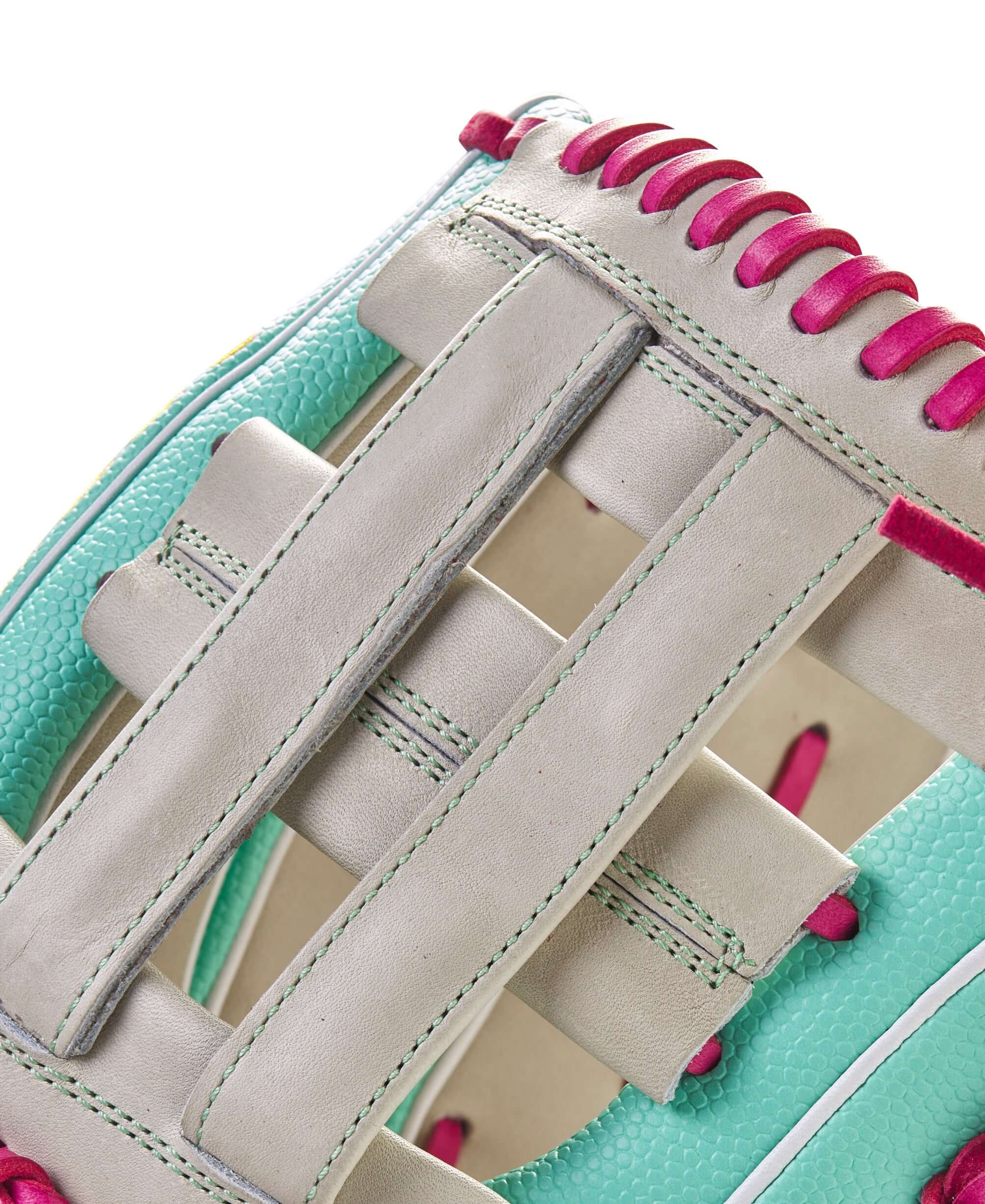 Close-up of Wilson A2000 Glove of the Month featuring turquoise and pink design elements for September 2023.