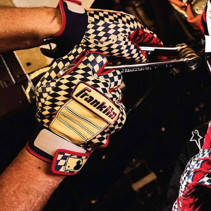Franklin CFX Pro Limited Edition Speed Series Youth gloves, close-up of checkered pattern and logo on hand gripping tool.