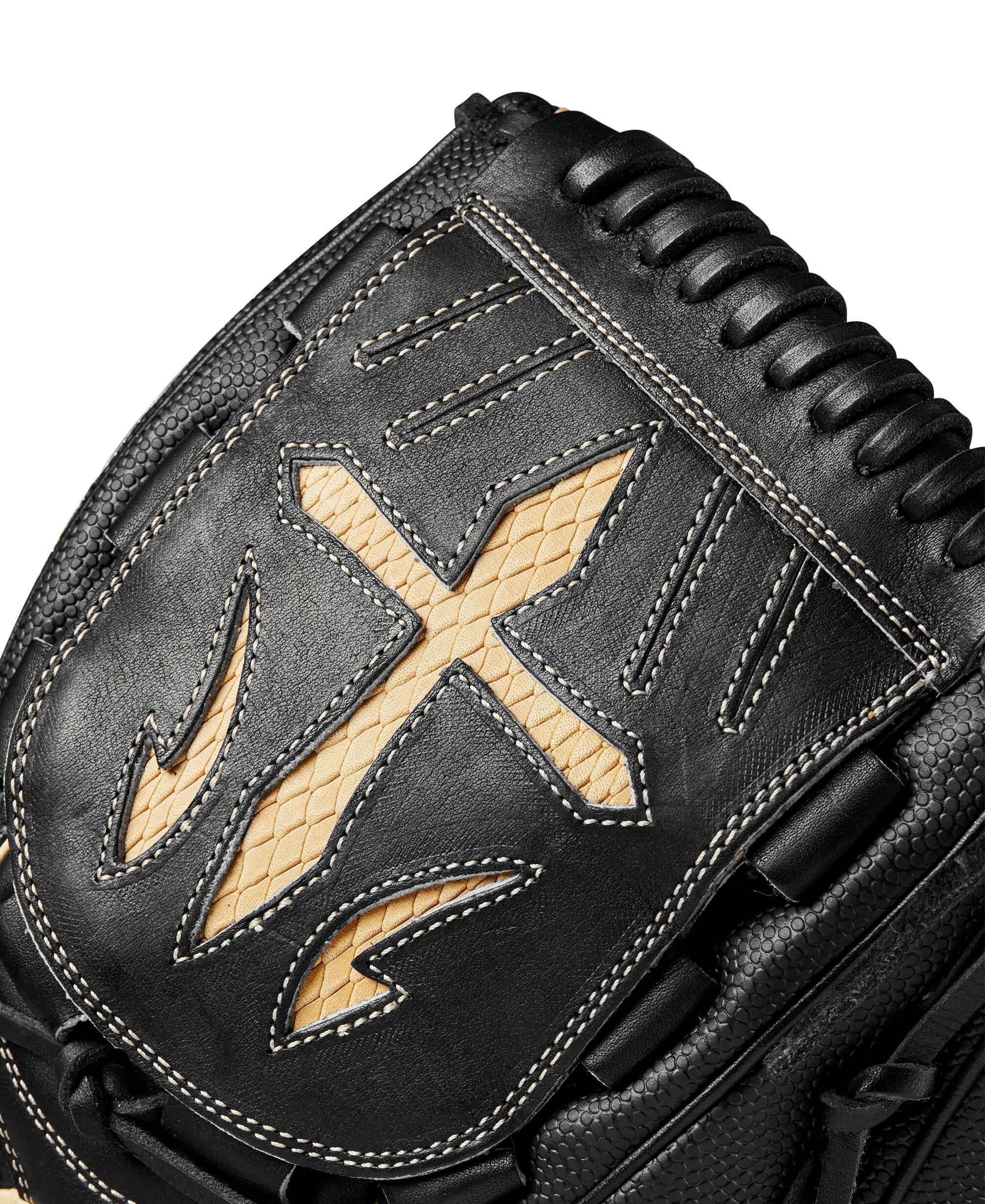 Close-up of the Wilson A2000 B23 black and saddle tan baseball glove featuring detailed stitching and leather texture.