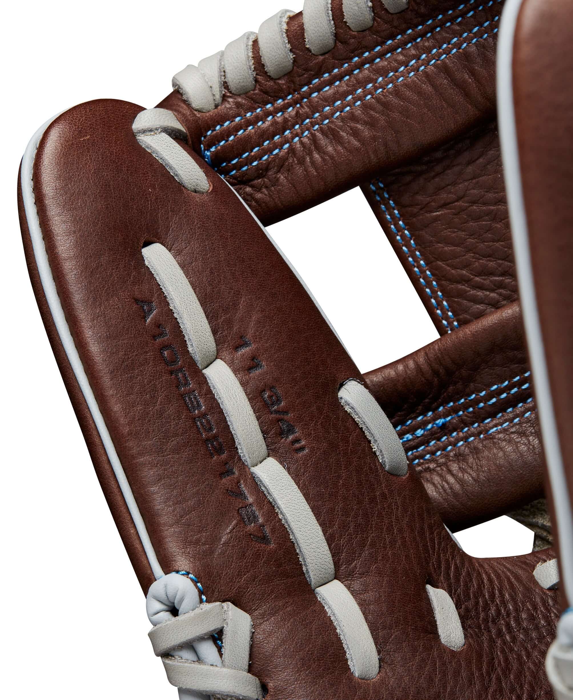Close-up of the Wilson 2024 A1000 1787 infield baseball glove, showcasing dark brown leather and detailed stitching.
