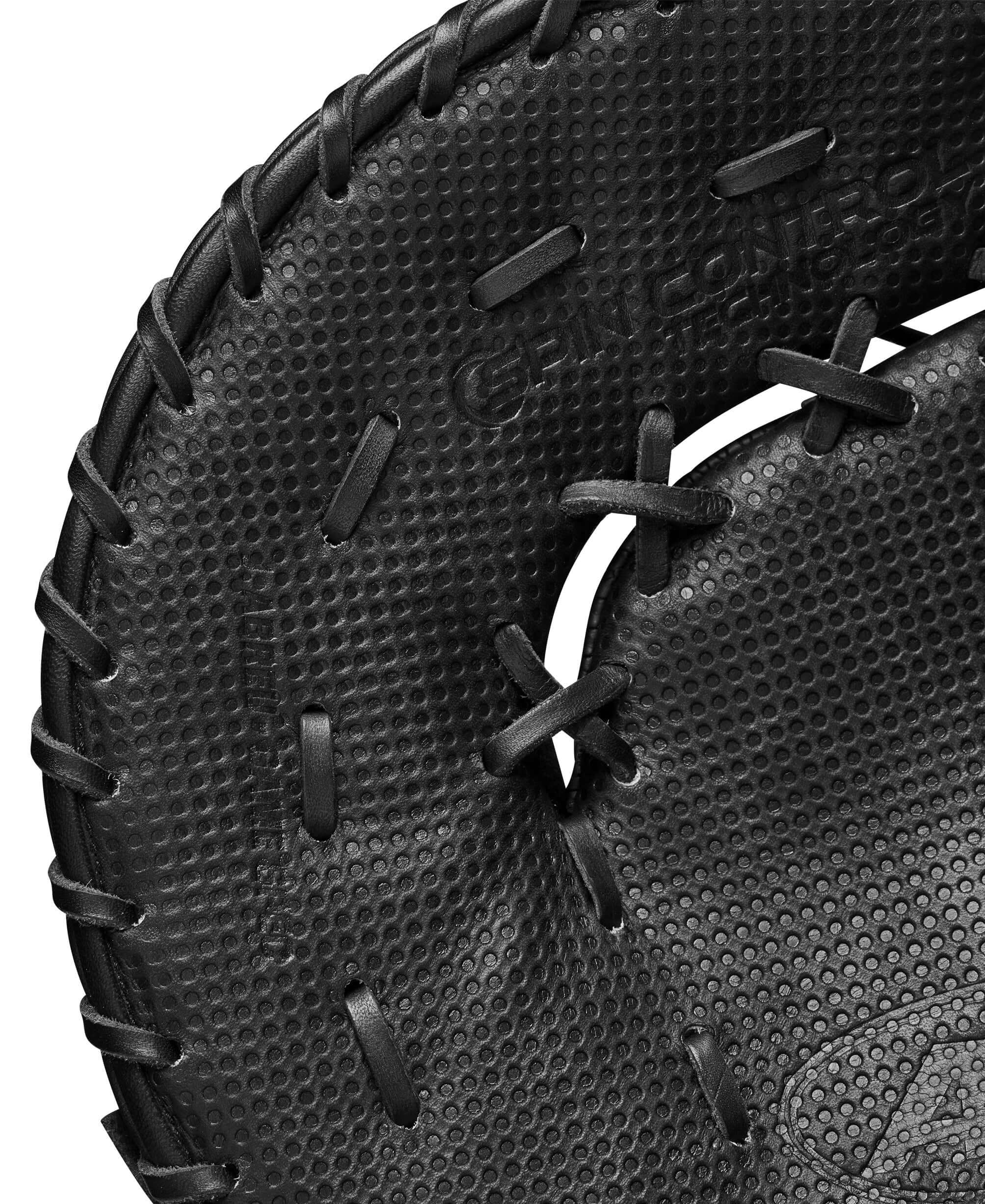 Close-up of Wilson A2K Jose Abreu first base mitt showcasing Spin Control Technology and high-quality Black Pro Stock leather.