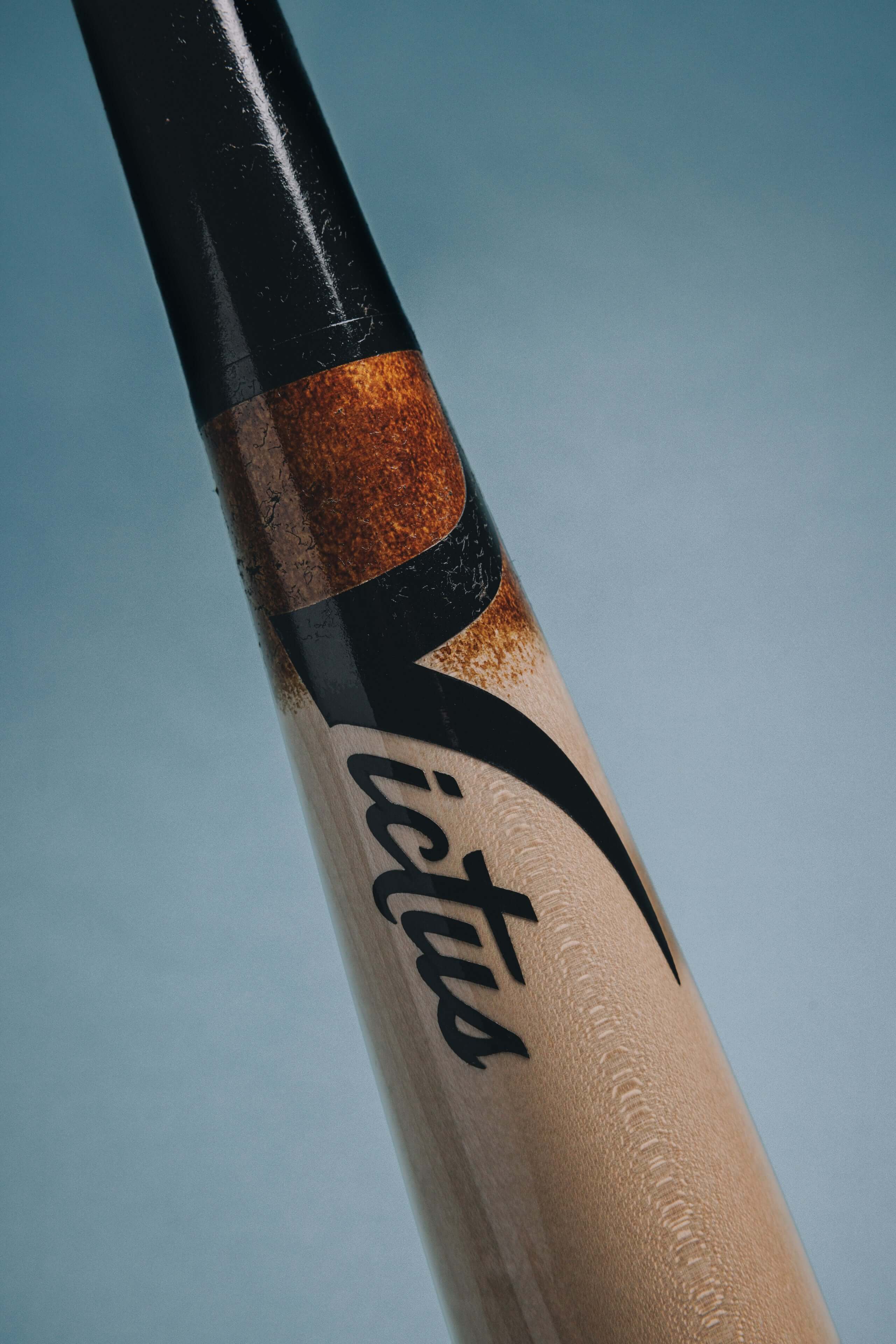 Victus ADLEY35 pro reserve bat with glossy black and natural finish, showcasing the brand logo and detailed design.