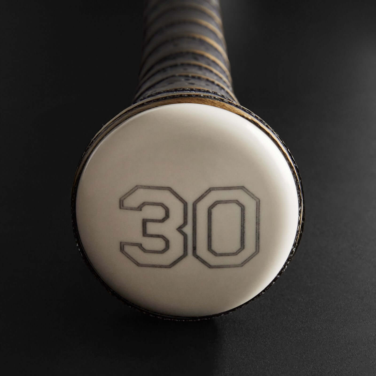 Detailed view of patented Pommel Precision Knob, showcasing unparalleled comfort and control for the hitter.
