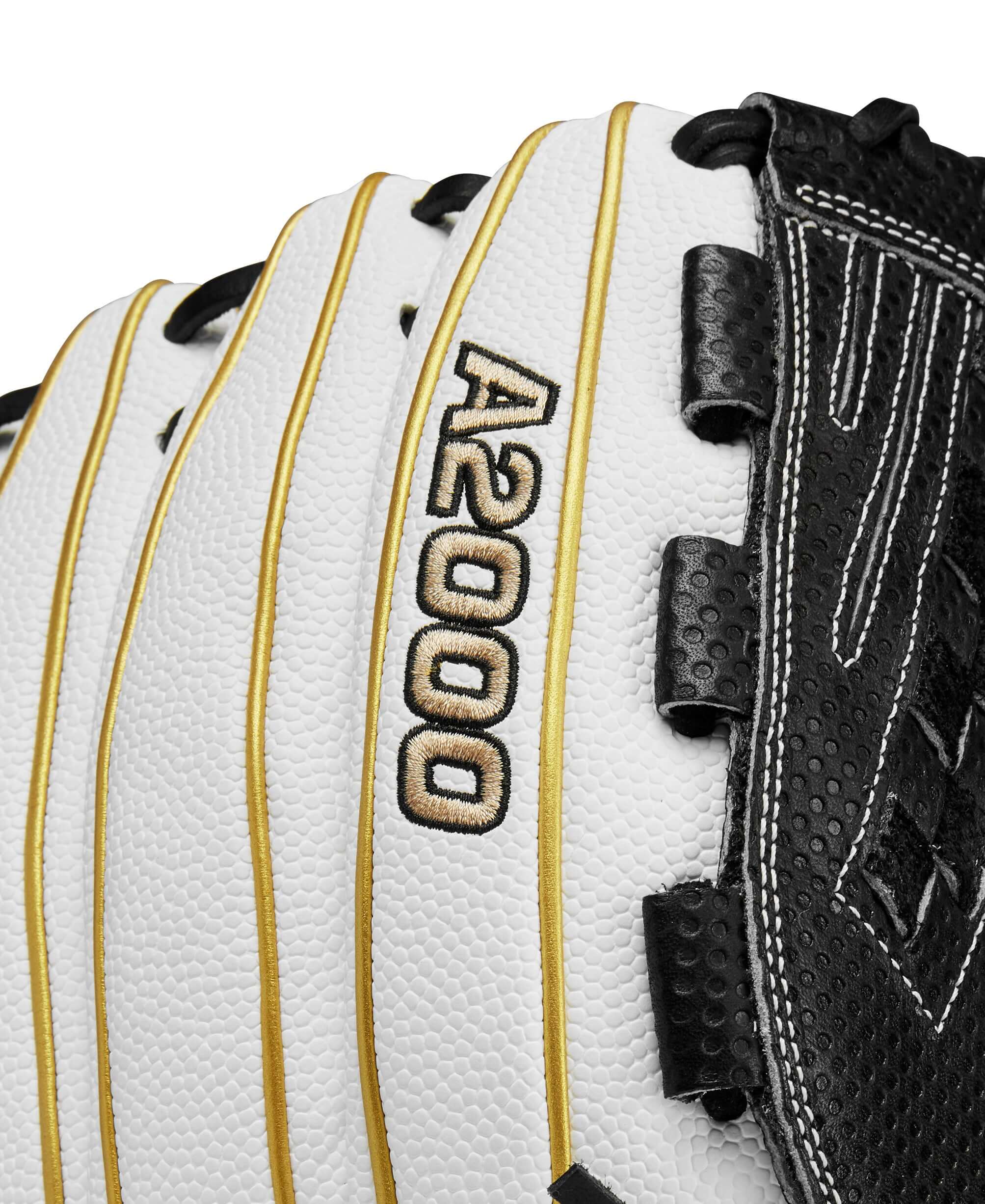 Close-up of Wilson A2000 glove with white, black, and gold design, showcasing Spin Control Technology and durable stitching.