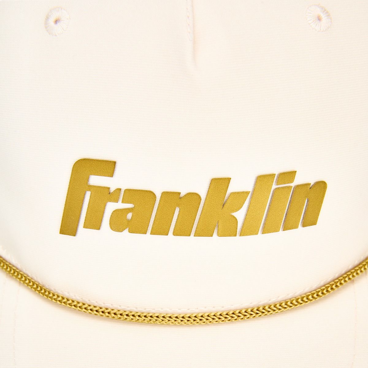 Close-up of the Franklin Vanilla Gold Snapback Baseball Hat showcasing the raised gold logo and colored rope detailing.
