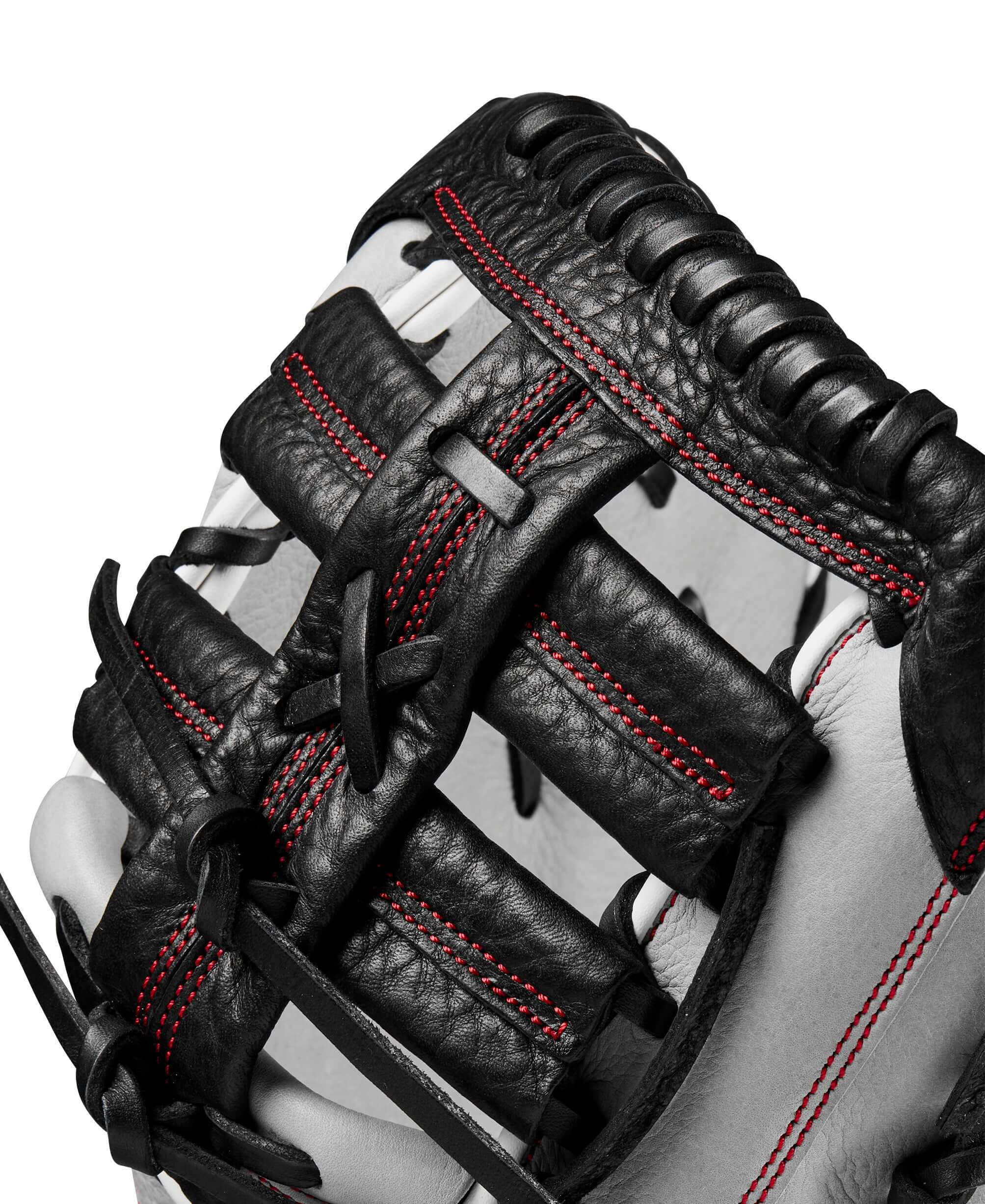 Wilson 2024 A1000 1620 first base mitt showing black and grey leather with red stitching details.
