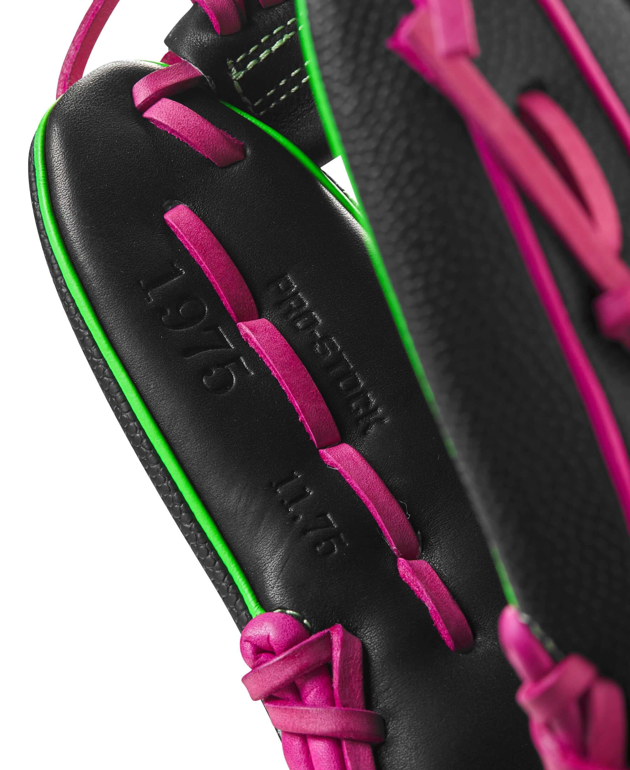 Wilson A2000 1975 Party Time glove interior with black leather, pink lacing, and embossed details for enhanced durability.