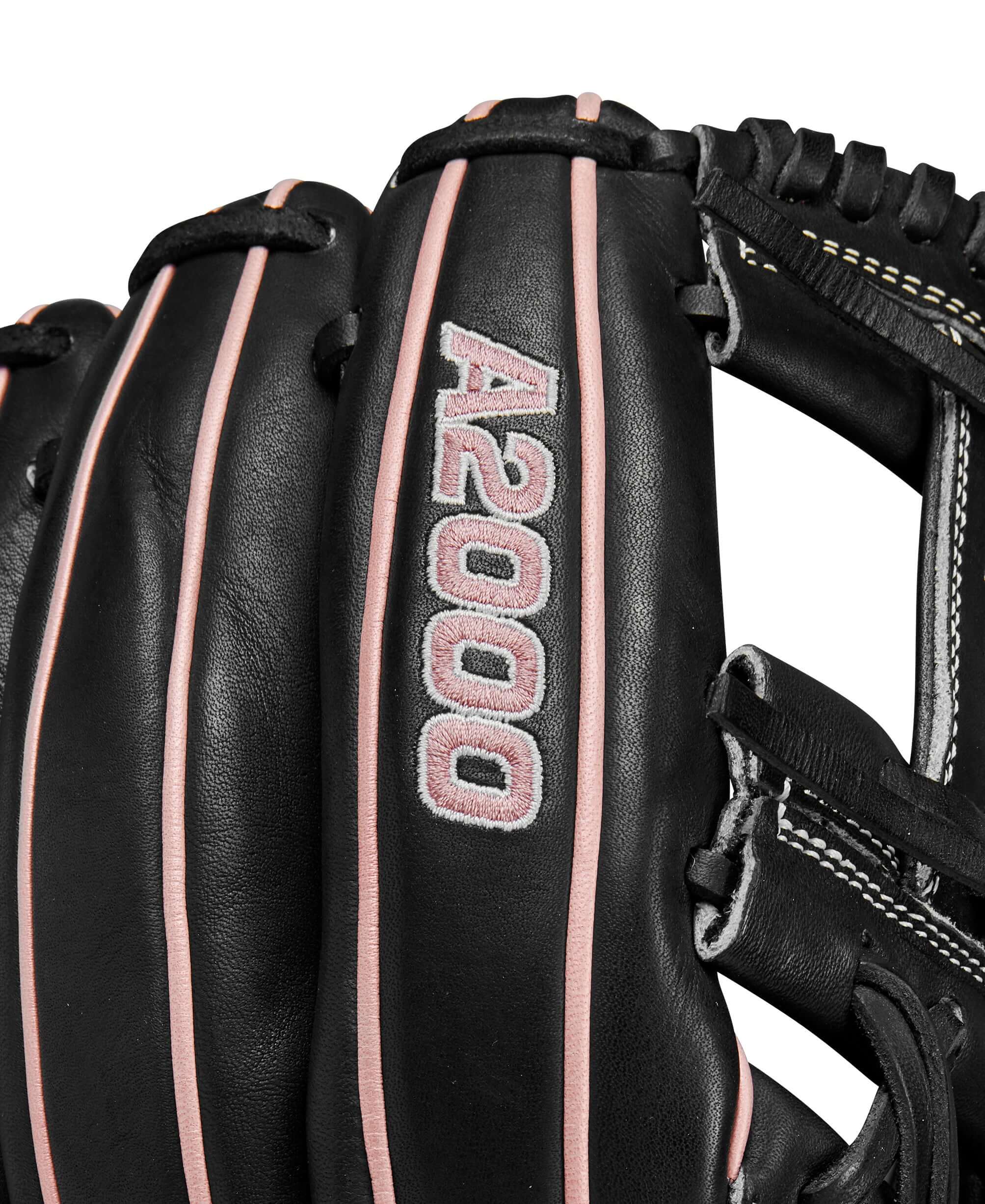 Close-up of Wilson A2000FP H12 infield glove showcasing black leather with rose gold accents and detailed stitching.