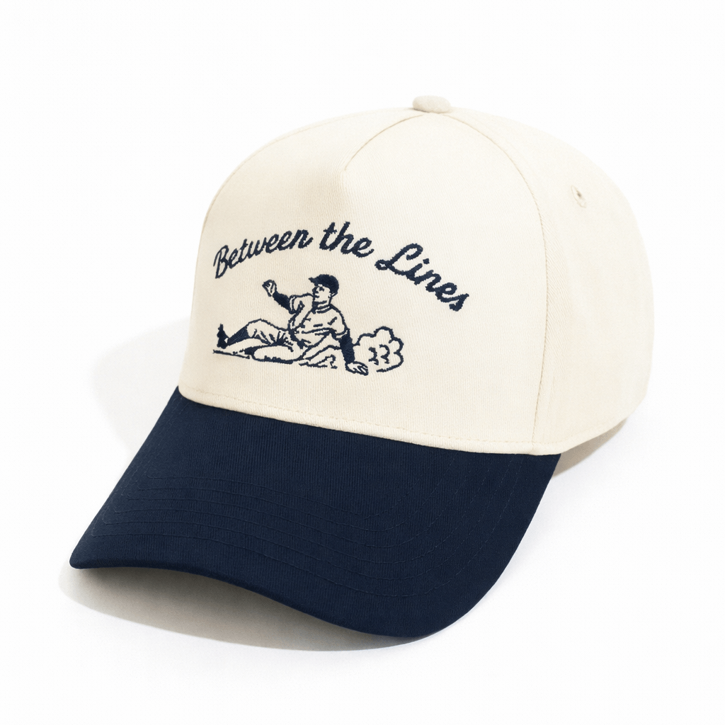 BTL Sliding Man A-Frame Snapback with embroidered baseball player and blue brim, quarter-front view.
