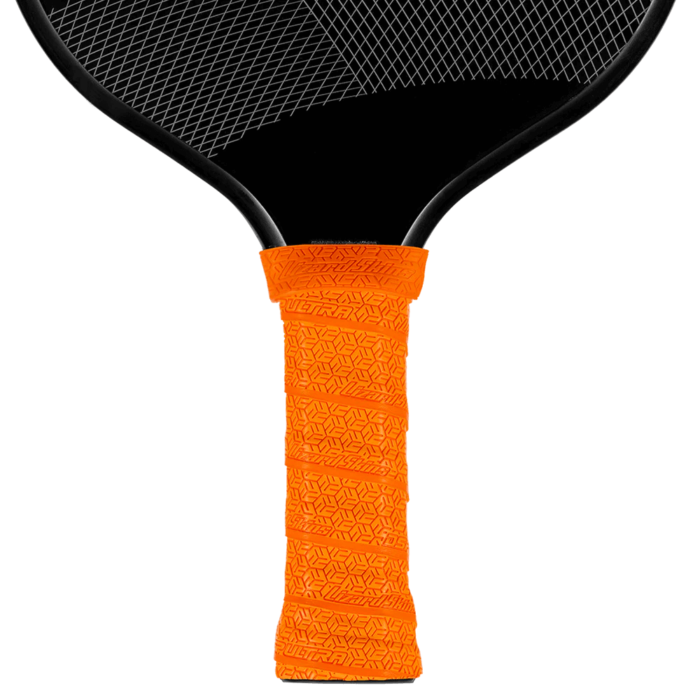 Lizard Skin DSP Ultra Pickleball Grip in tangerine orange on a paddle, showcasing its texture and premium adhesive design.