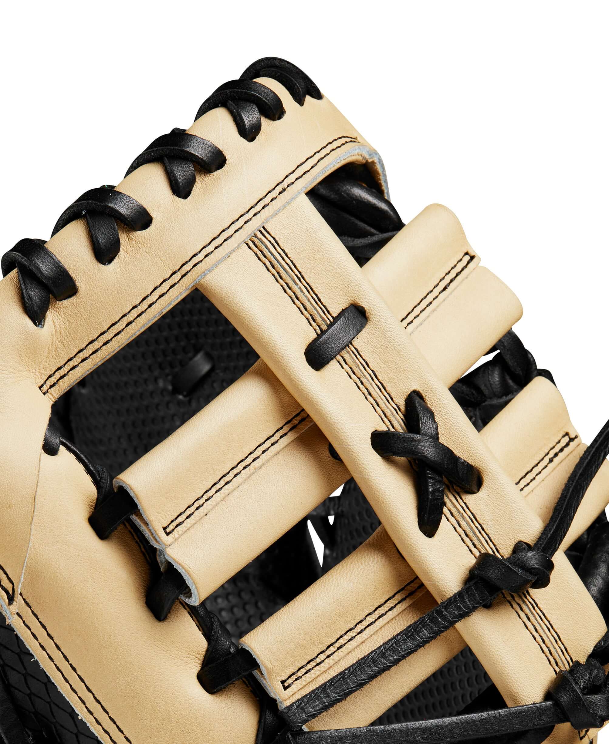 Close-up of Wilson A2K first base mitt showcasing premium leather and innovative lacing for enhanced performance.