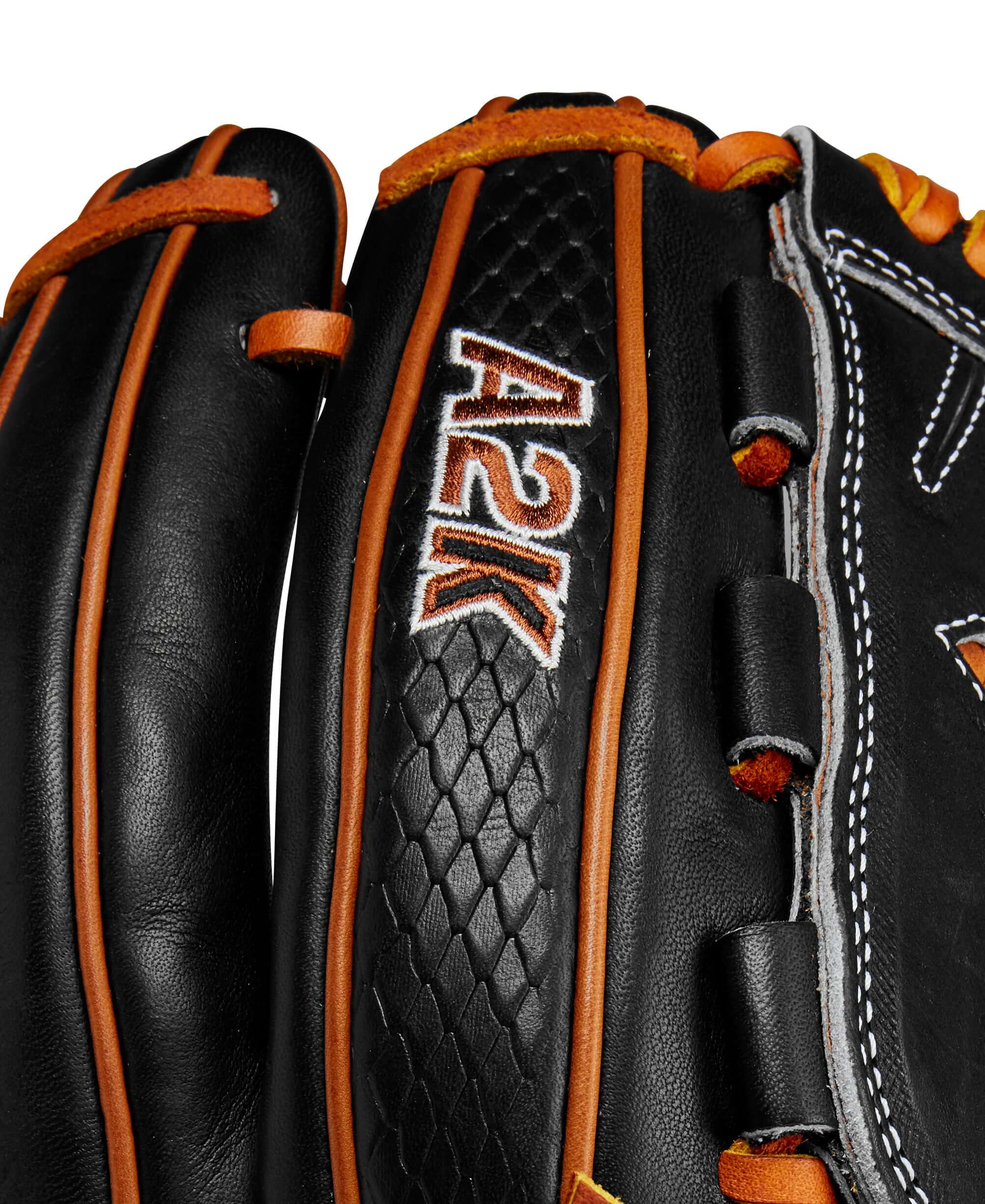 Close-up of Wilson A2K B23 pitcher's glove showing the black leather and orange stitching details.