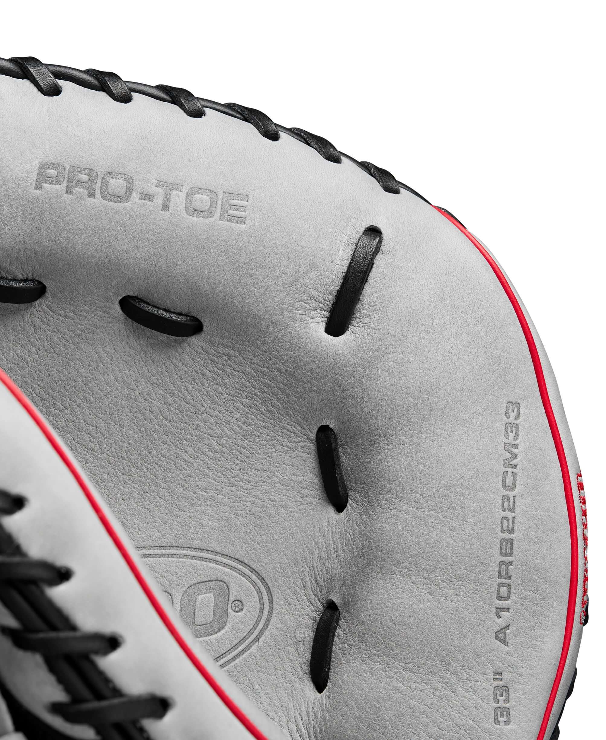 Close-up of Wilson 2024 A1000 CM33 baseball catcher's mitt showcasing Pro-Toe and detailed stitching.