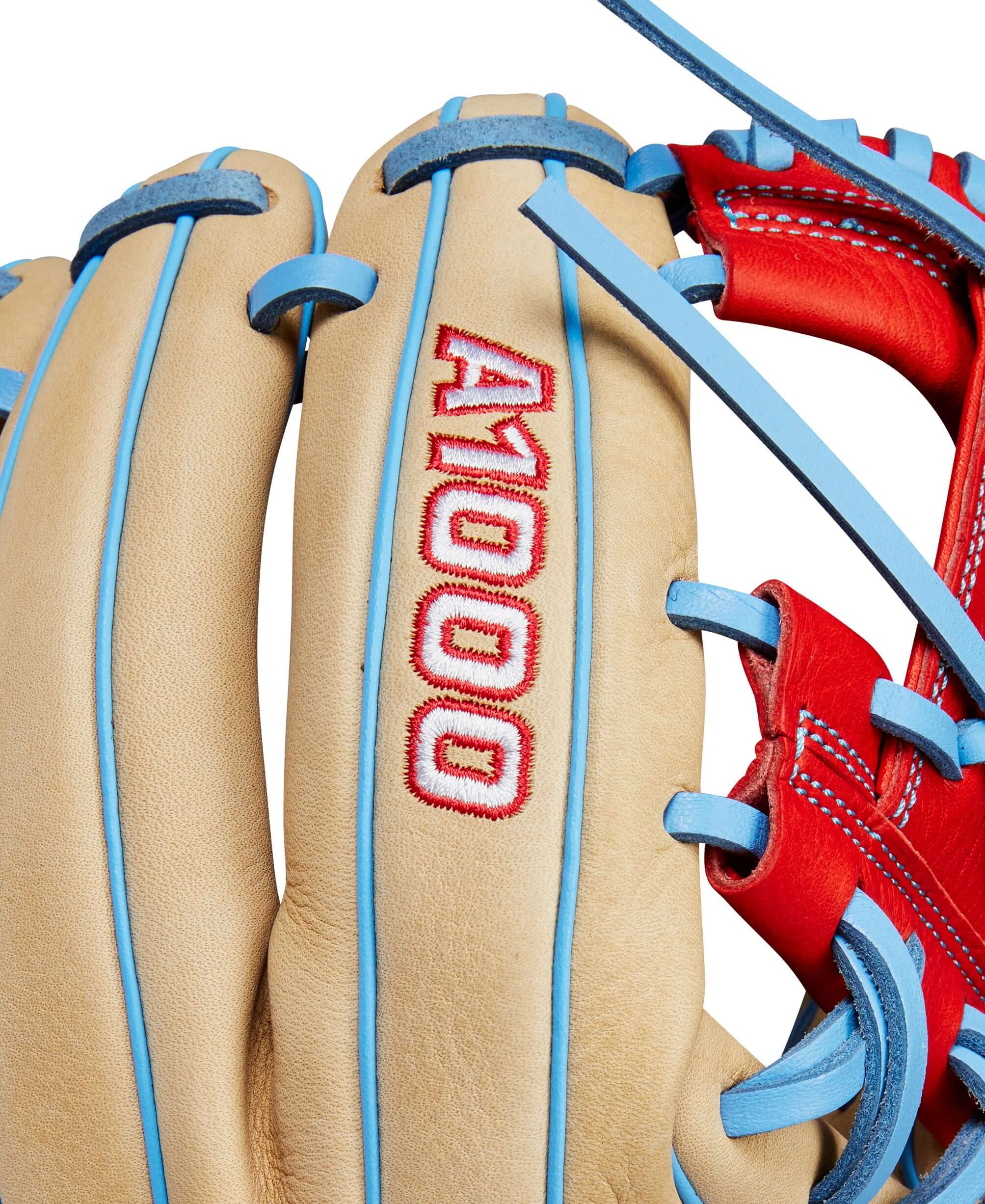 Close-up of Wilson A1000 1786 infield baseball glove showcasing Blonde leather and Red/Blue accents.