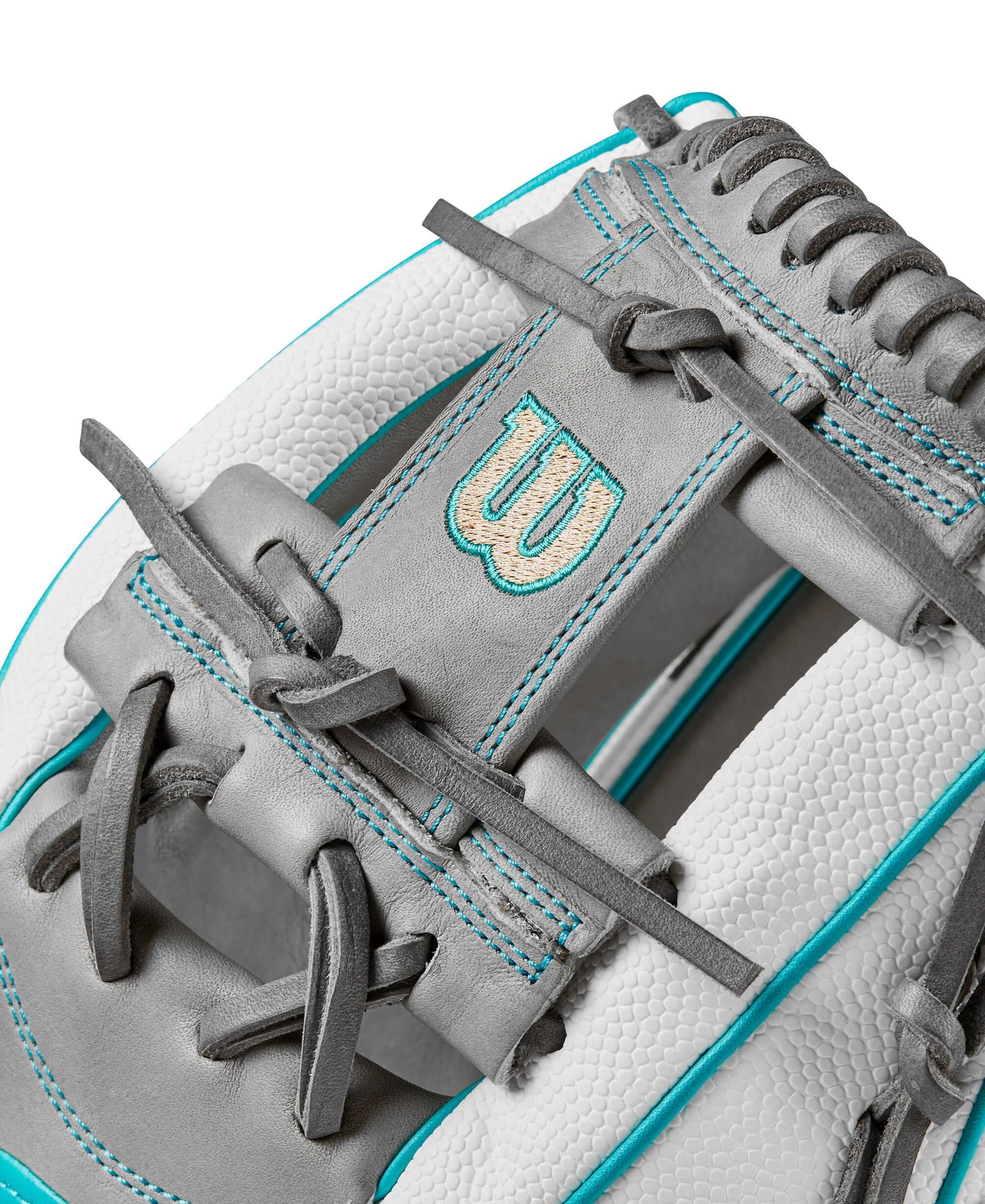 Close-up of the Wilson 2024 A2000FP H75 fastpitch glove featuring grey leather and teal accents with H-Web design.