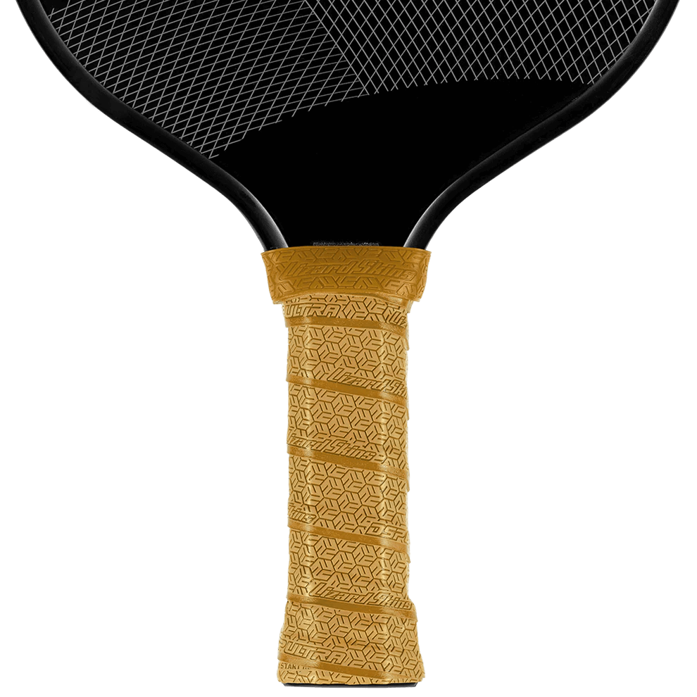 Lizard Skin DSP Ultra Pickleball grip in Vegas Gold on a paddle, showcasing its texture and premium adhesive.