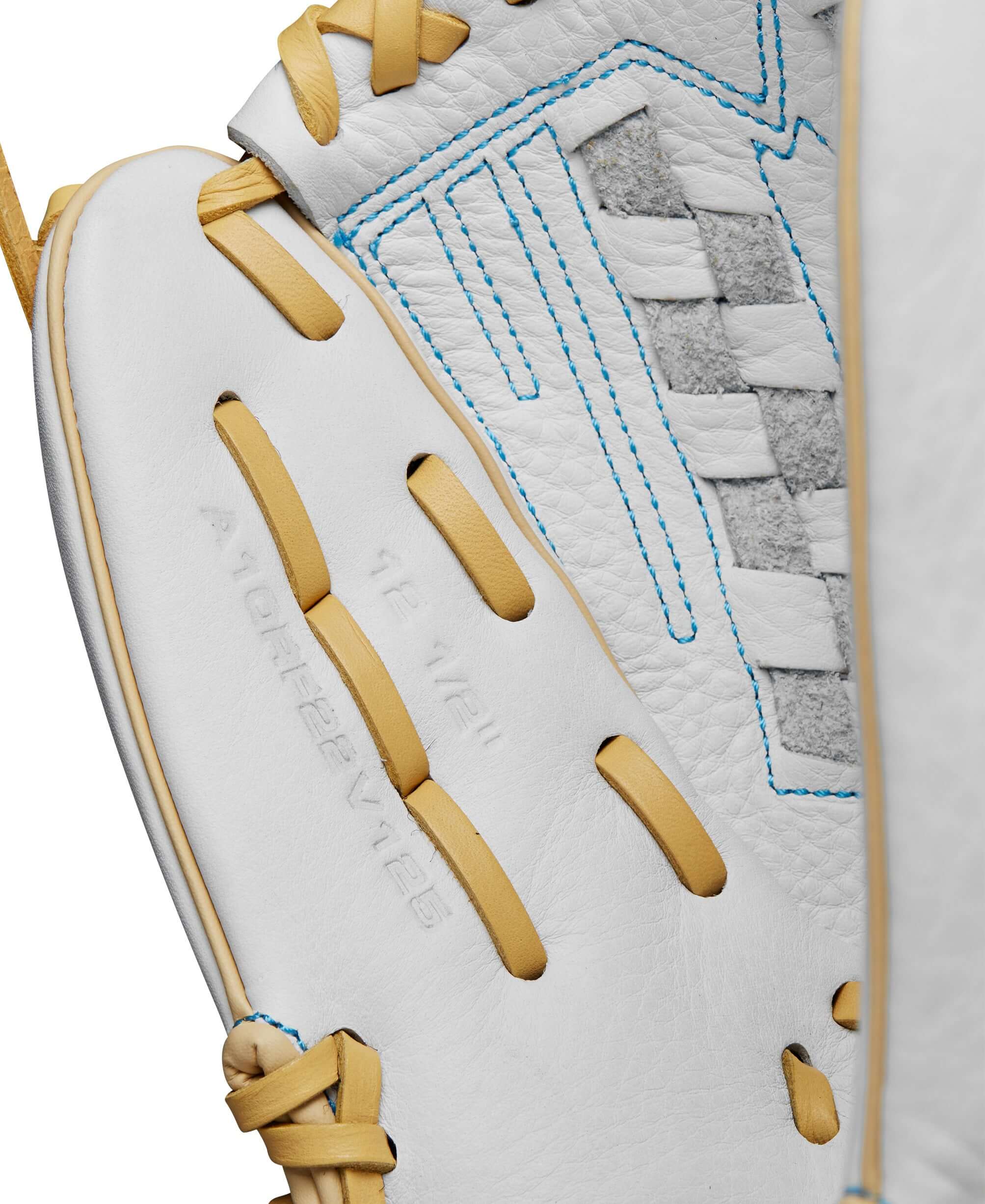 Close-up of Wilson A1000 V125 fastpitch softball glove interior with white leather and blue stitching details.