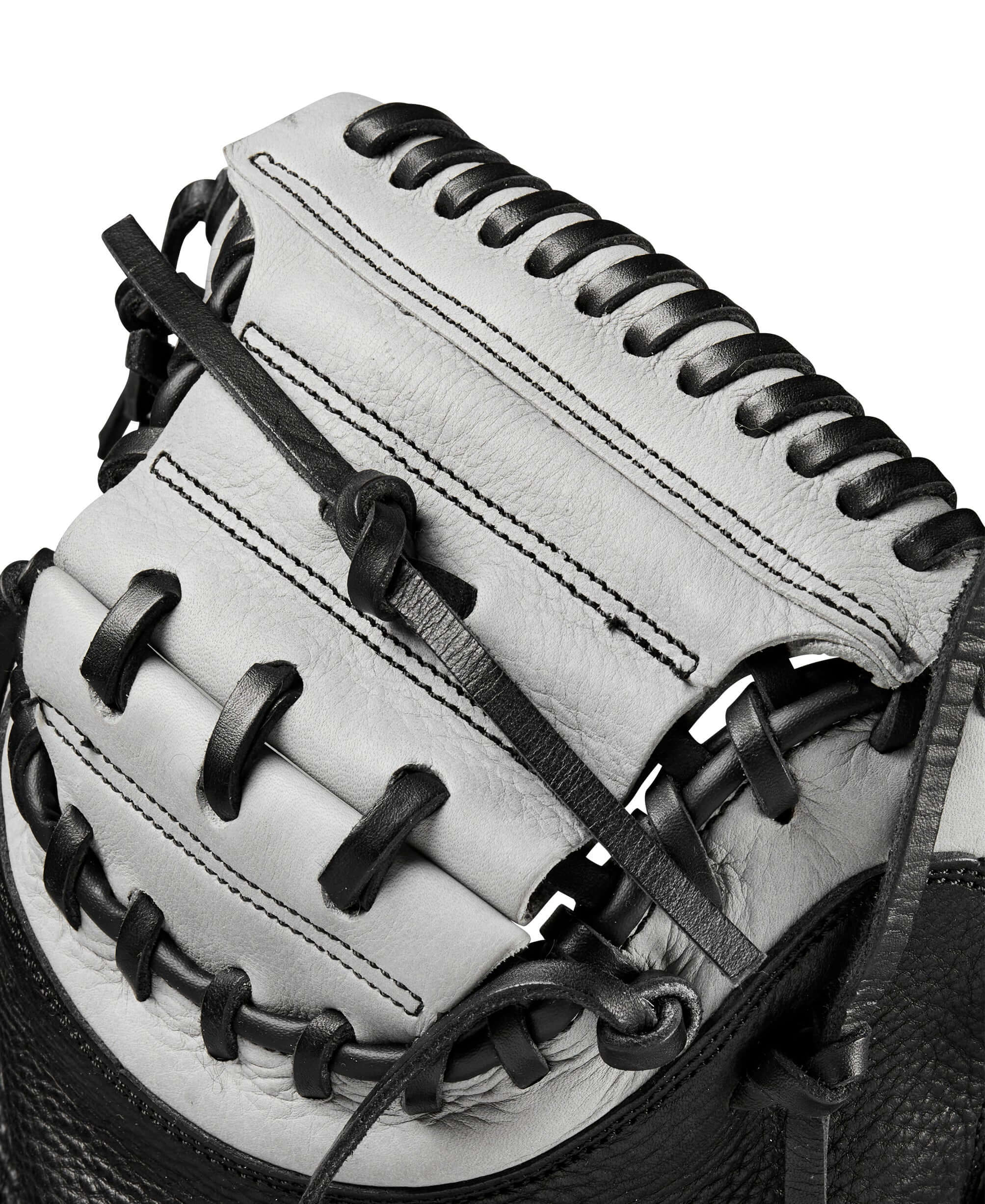Close-up of the Wilson A1000 CM33 catcher’s mitt showcasing the deep pocket and Half Moon Web design.