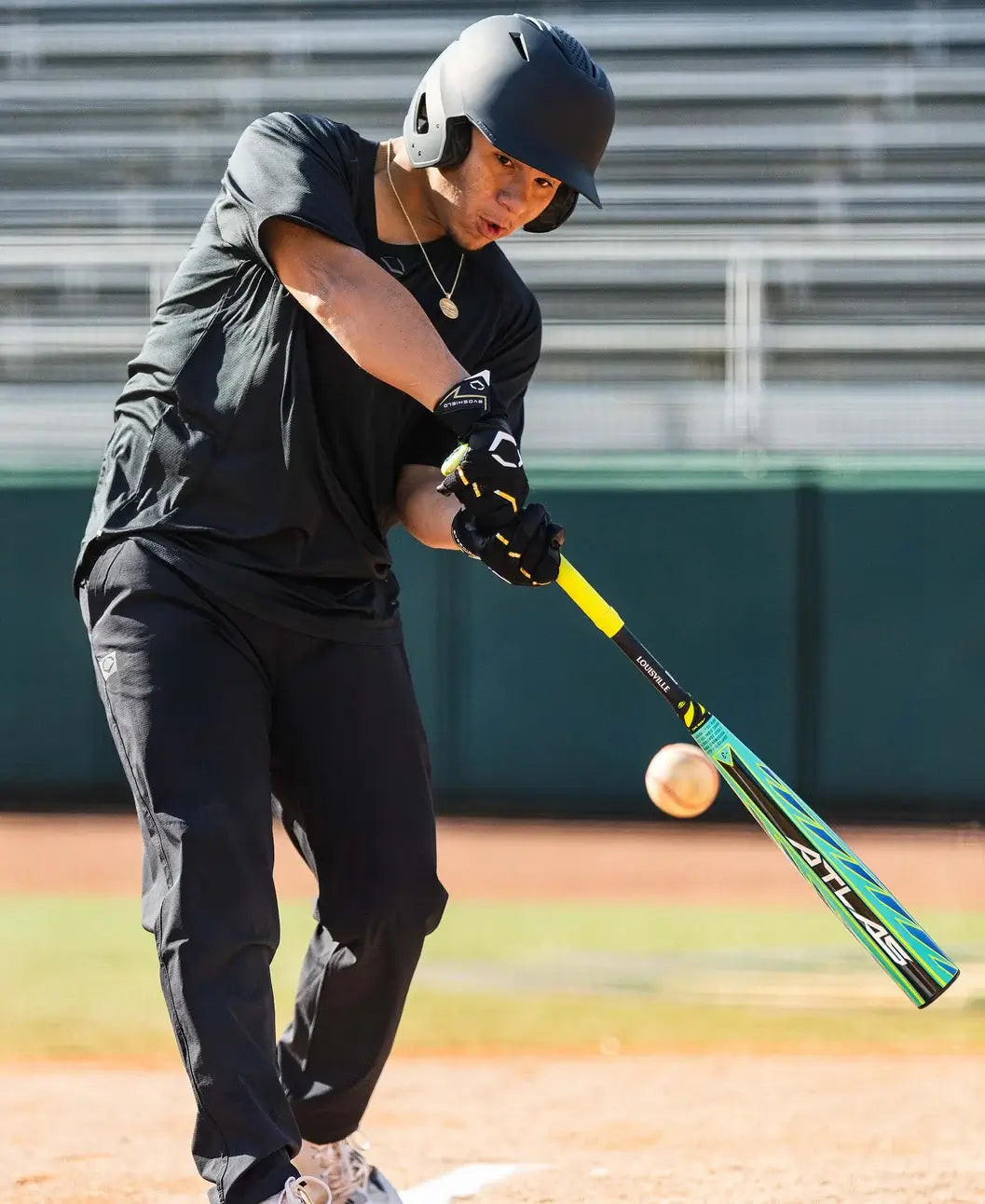 Player using 2026 Louisville Slugger Atlas Hybrid Green (-3) BBCOR Baseball Bat during practice