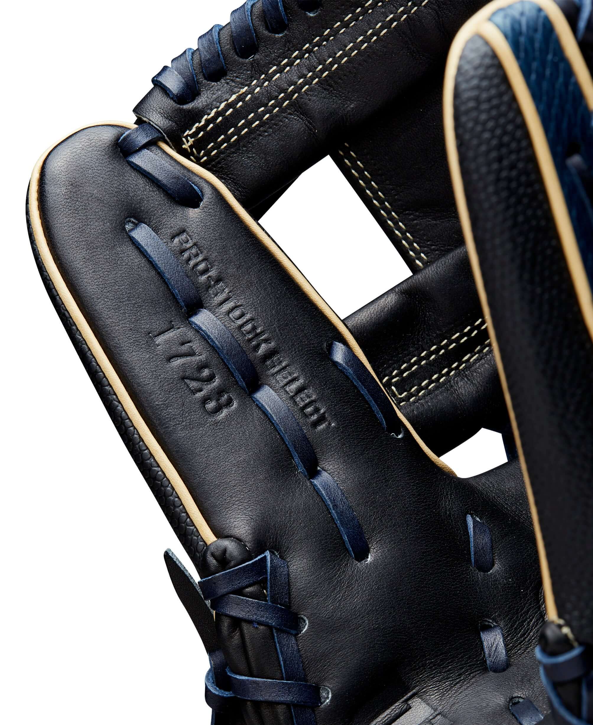 Interior view of Wilson A2K 1723 glove showcasing navy and black leather with detailed stitching and padding.