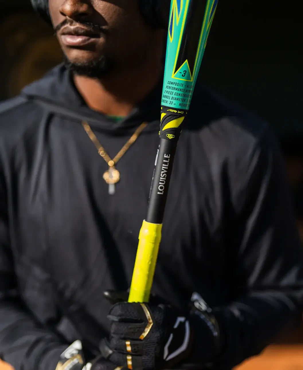 Player holding the 2026 Louisville Slugger Atlas Hybrid Green (-3) BBCOR Baseball Bat