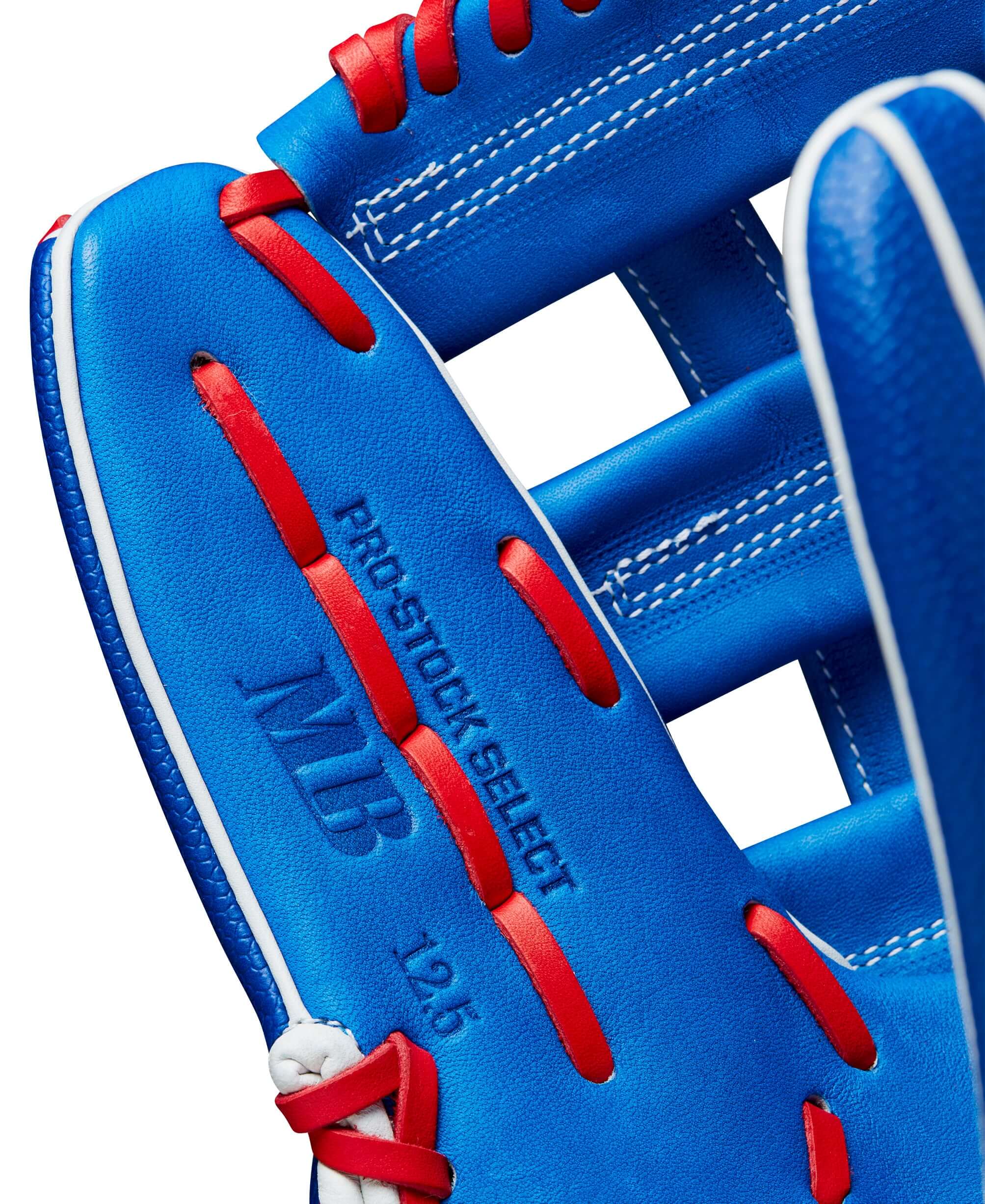 Close-up of Wilson A2K Mookie Betts glove interior, featuring Pro Stock Select leather and vibrant blue design.