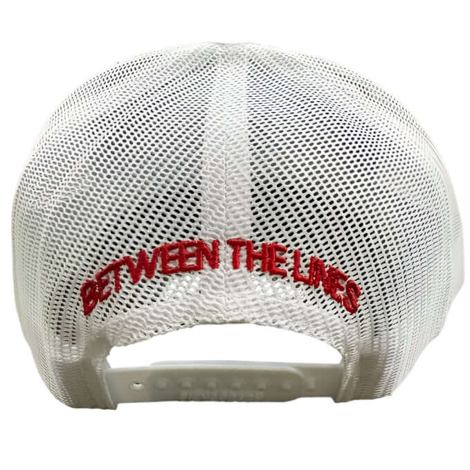 Back view of Richardson BTL 112 Split Black/White cap showing red 'Between the Lines' embroidery on white mesh with snap closure.
