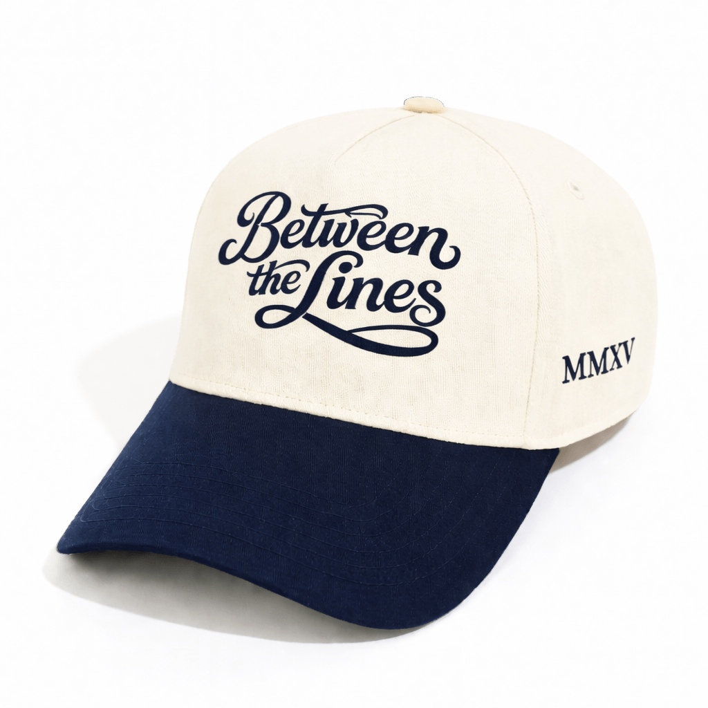 BTL Cursive MMXV A-Frame Snapback with structured crown, curved brim, script logo on front, and MMXV on the side, angled view