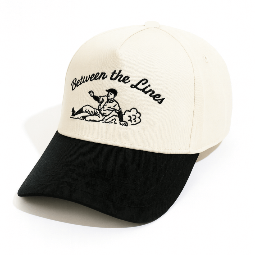 BTL Sliding Man Cream/Black A-Frame Snapback with embroidered design and black visor.