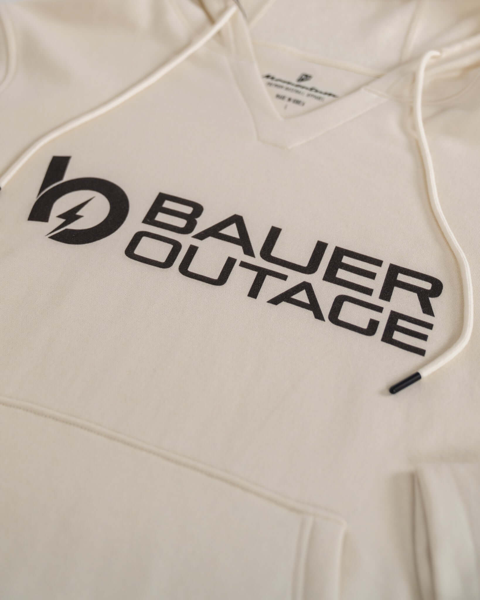 Bauer Outage heavyweight hoodie featuring notch-neck collar and large logo on soft fabric.