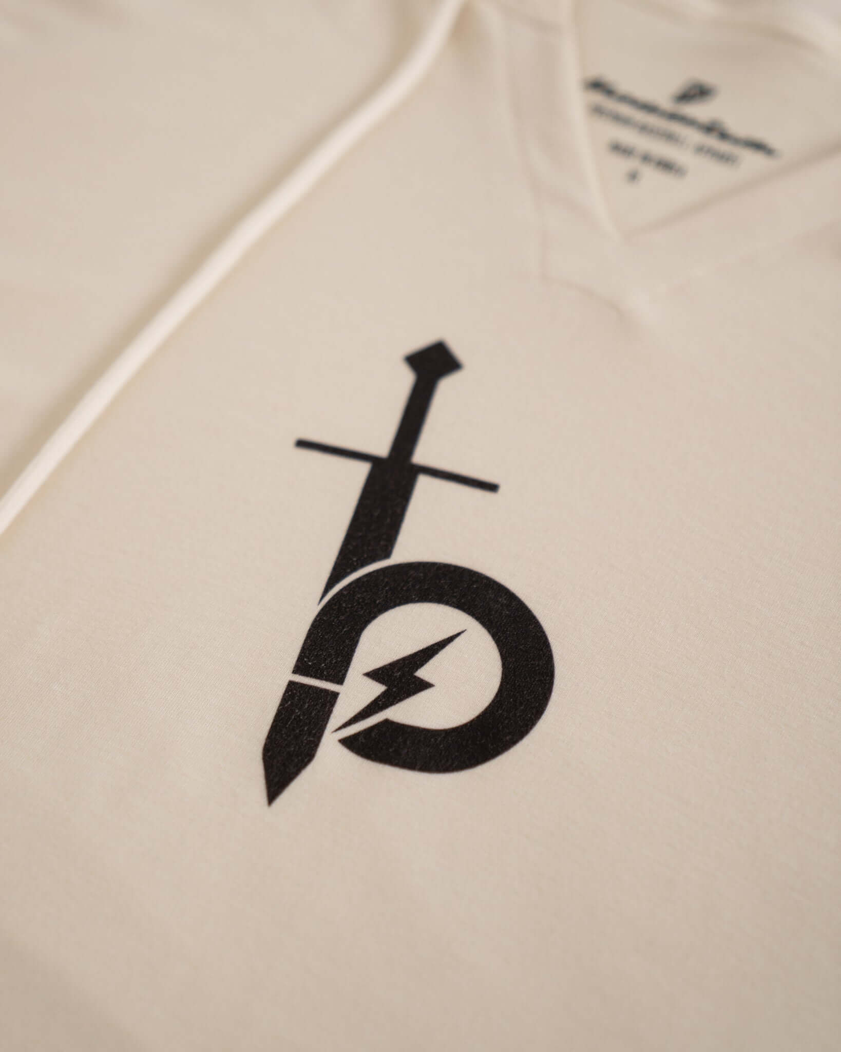 Close-up of the Bauer OutageTan Short Sleeve Hoodie showcasing its unique notch-neck collar and logo design.