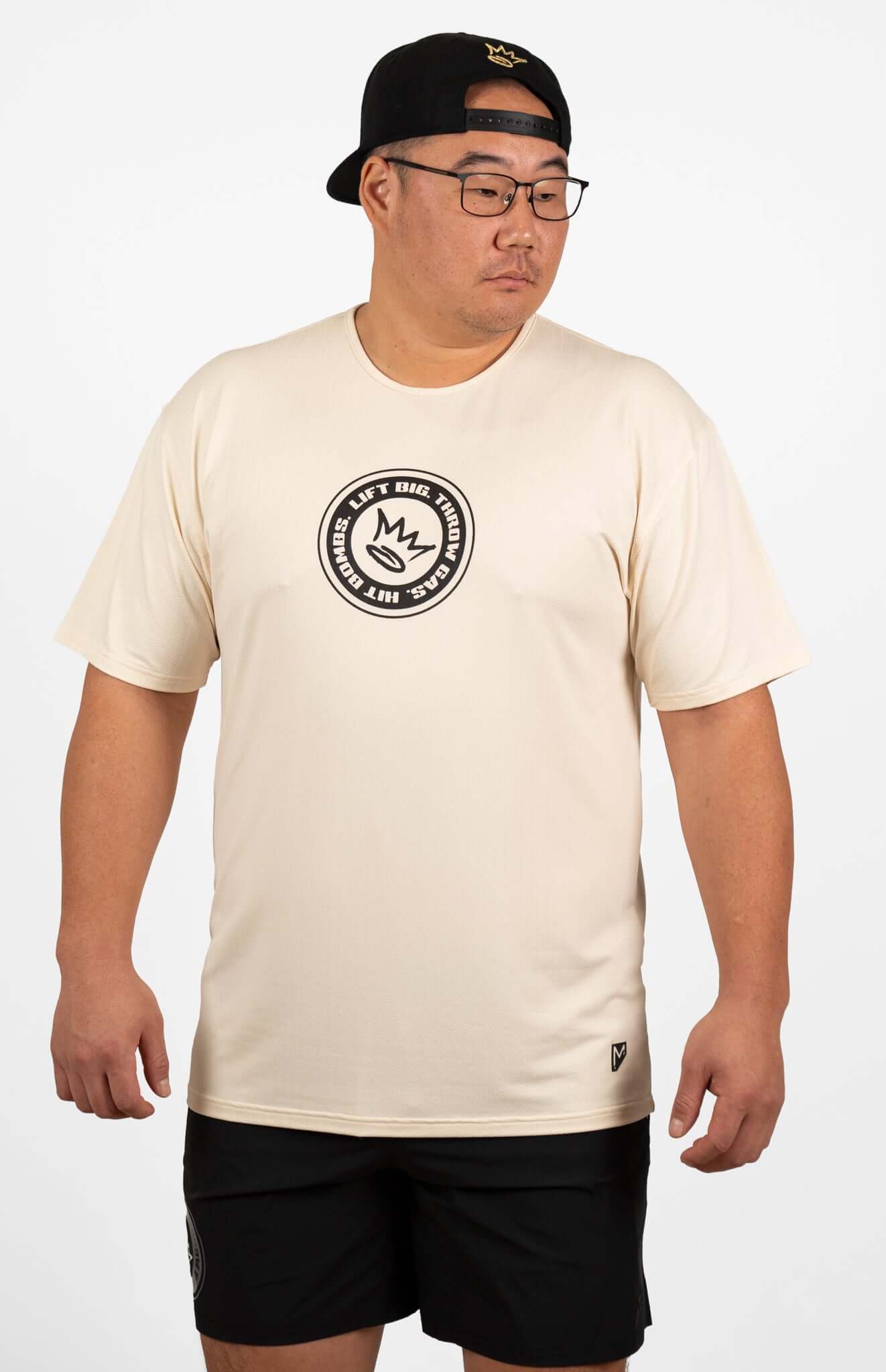 Man wearing King of Juco Tan Recovery Tee, featuring a relaxed fit and breathable fabric.