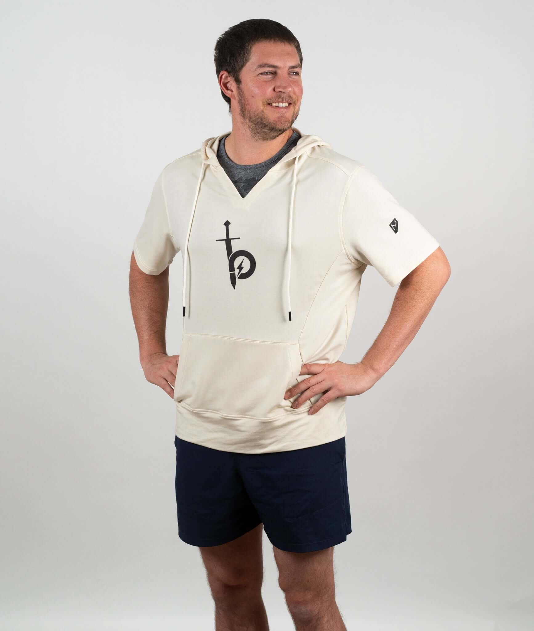 Model wearing a Bauer OutageTan Short Sleeve Hoodie, showcasing its comfortable fit and stylish design.