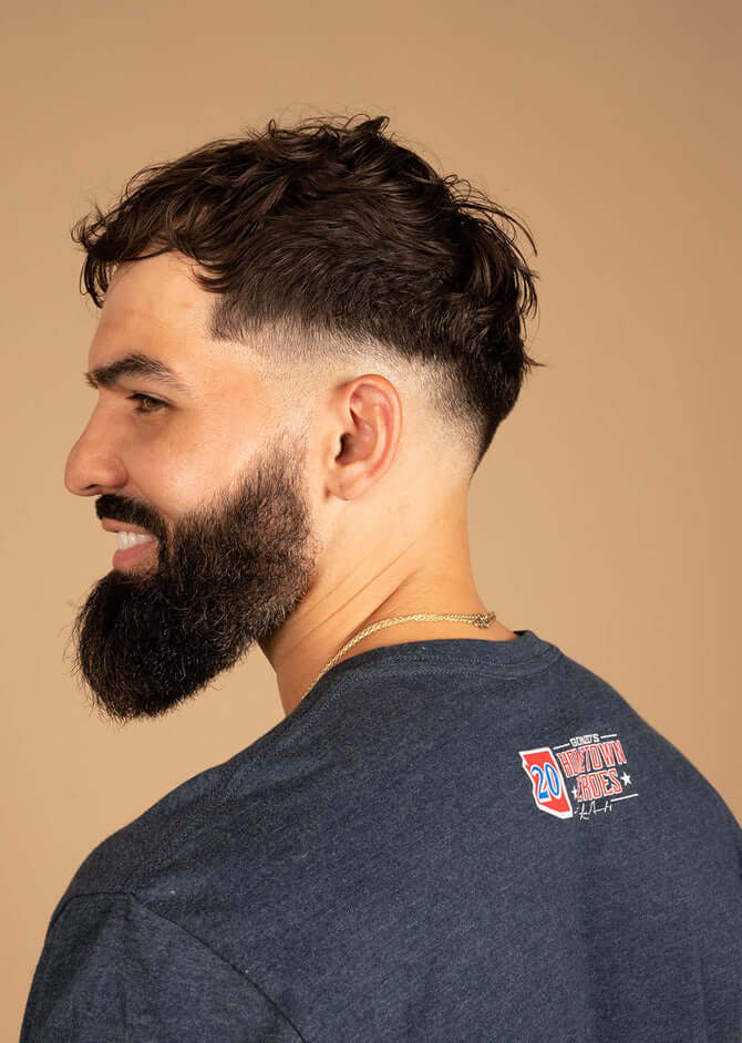 Man wearing State Forty Eight Midnight Navy crew shirt with unique design by Gonzo's Hometown Heroes, showcasing comfort and style.