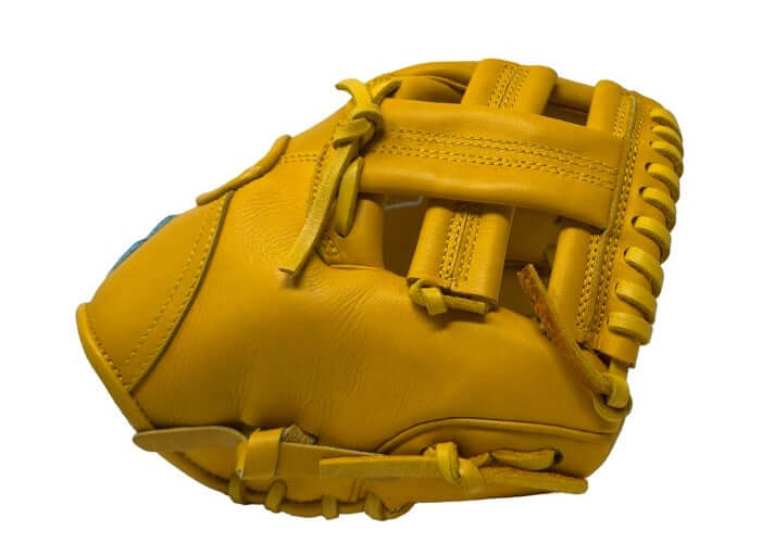 Side view of Sacco Ultra Smooth Kip 9.5" Infield Trainer in vibrant yellow leather, showcasing its durable construction.