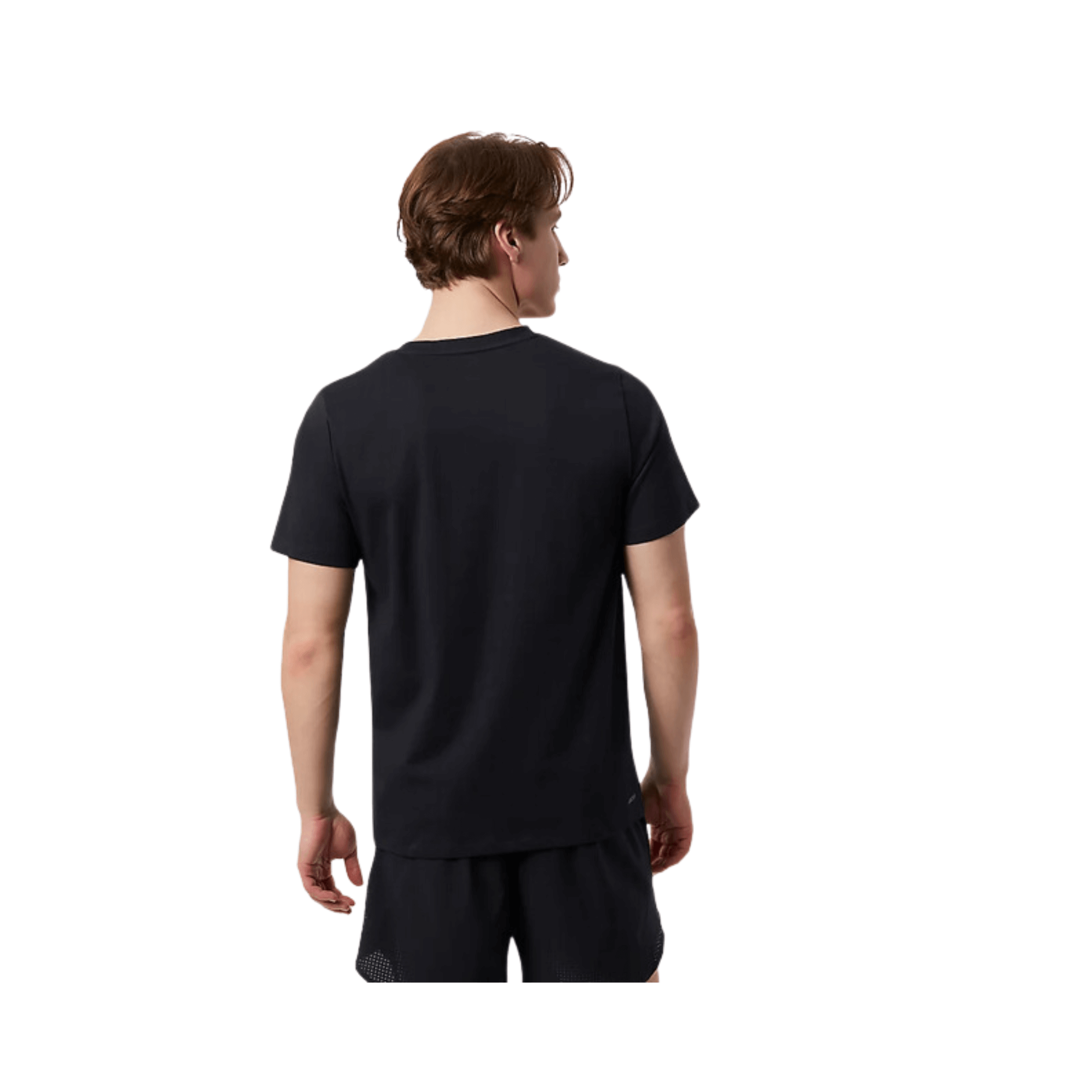 Back view of a man wearing a black New Balance Lindor Logo Tee, showcasing its comfortable fit and stylish design.