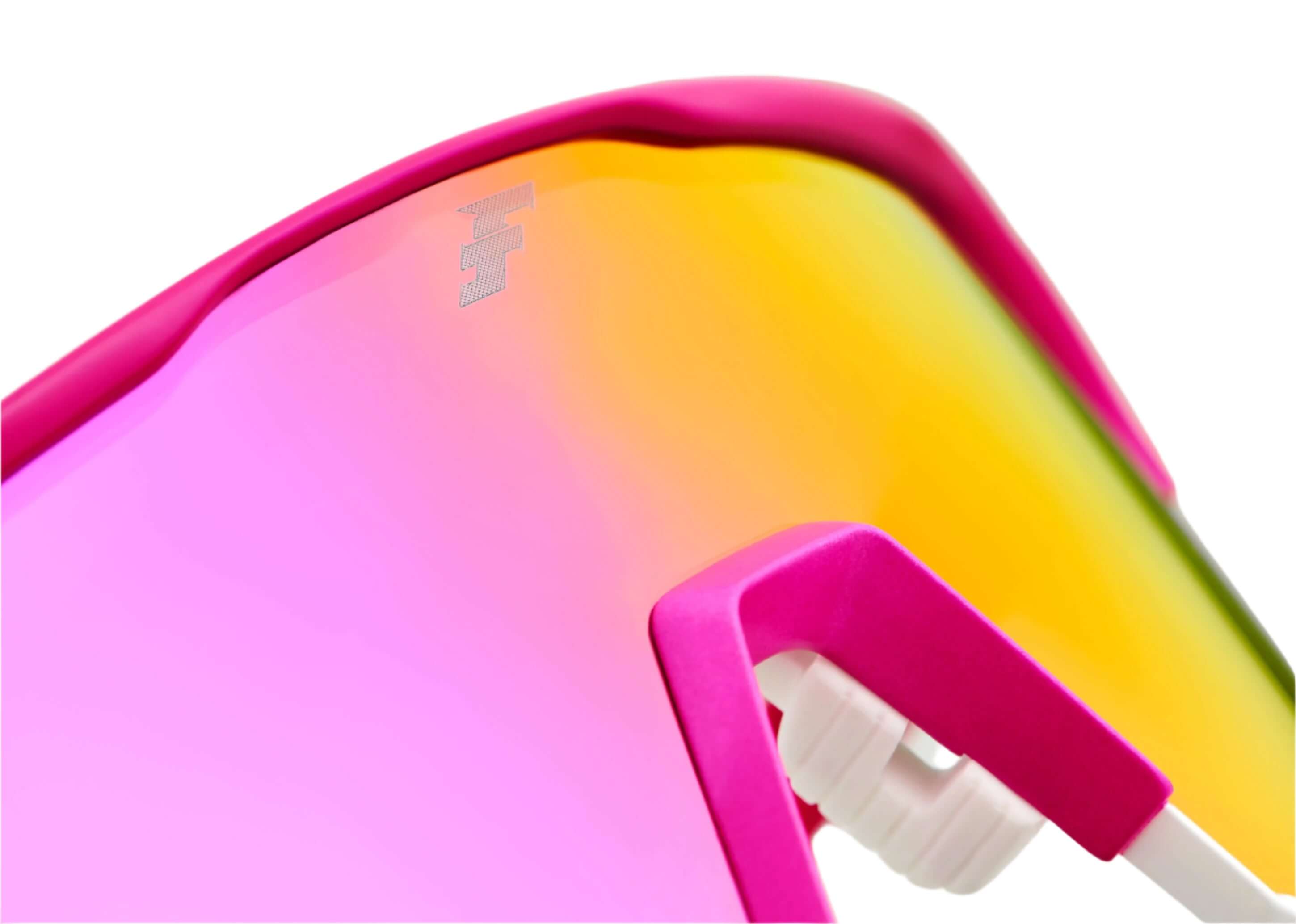 Close-up of 100% x Tatis HiPER Vital Pink mirror sunglasses showcasing vibrant pink lens and stylish design.