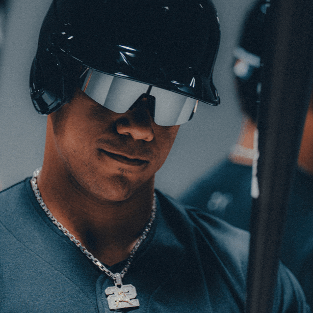 Person wearing 100% Speedcraft SL Soto sunglasses with HiPER Mercury mirror lens, showcasing polished black chrome design.