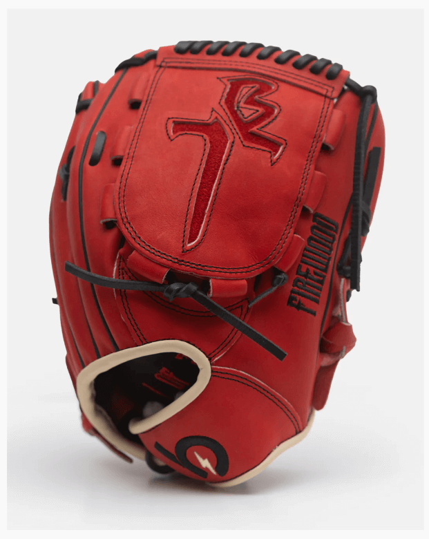 Trevor Bauer Firewood Limited Edition Pitcher Glove in red with black lacing, showcasing premium craftsmanship and unique design.