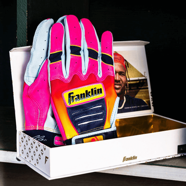 Franklin Jose Ramirez Limited Edition CFX Pro Youth gloves in citrus dawn color, palm view with Franklin logo on the wrist.