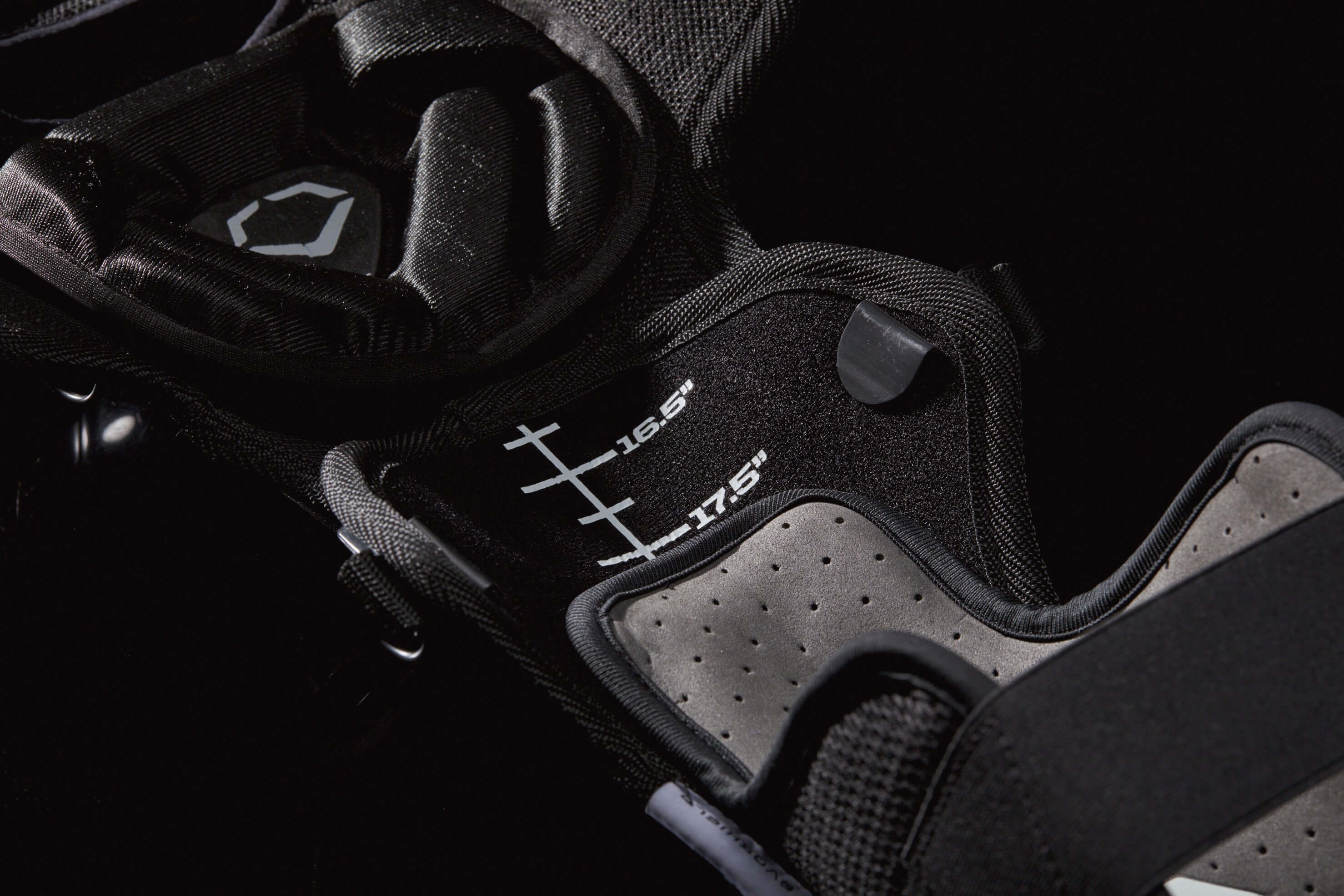 Close-up of Evoshield Pro-SRZ Catcher's Upper Leg Guards showcasing adjustment markings for a customizable fit.