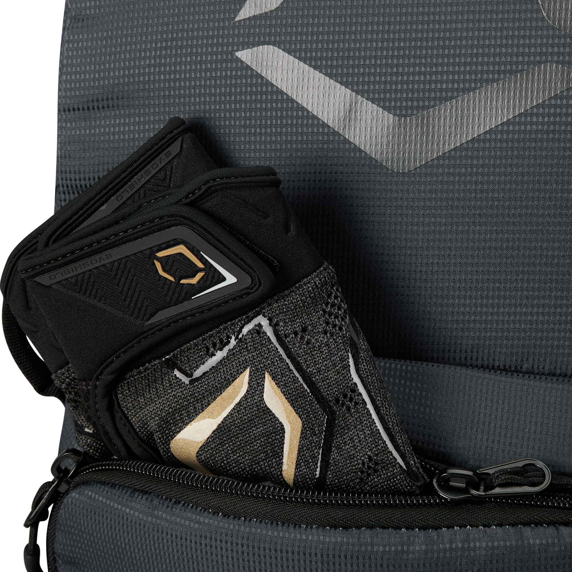 EvoShield SRZ-1 backpack showcasing a youth glove securely stored in the front pocket.
