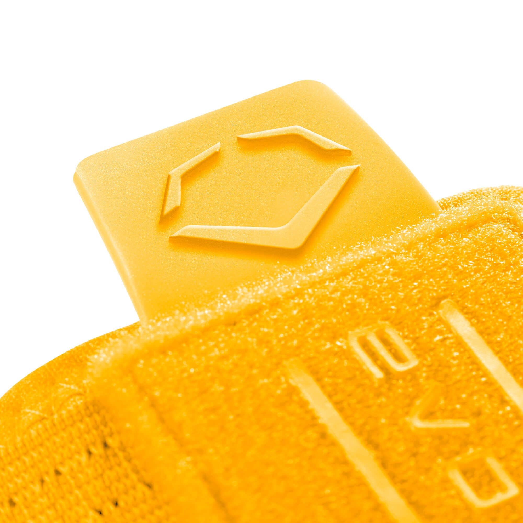 Close-up of yellow protective logo on EvoShield Sliding Mitt 2.0, showcasing durability and design.
