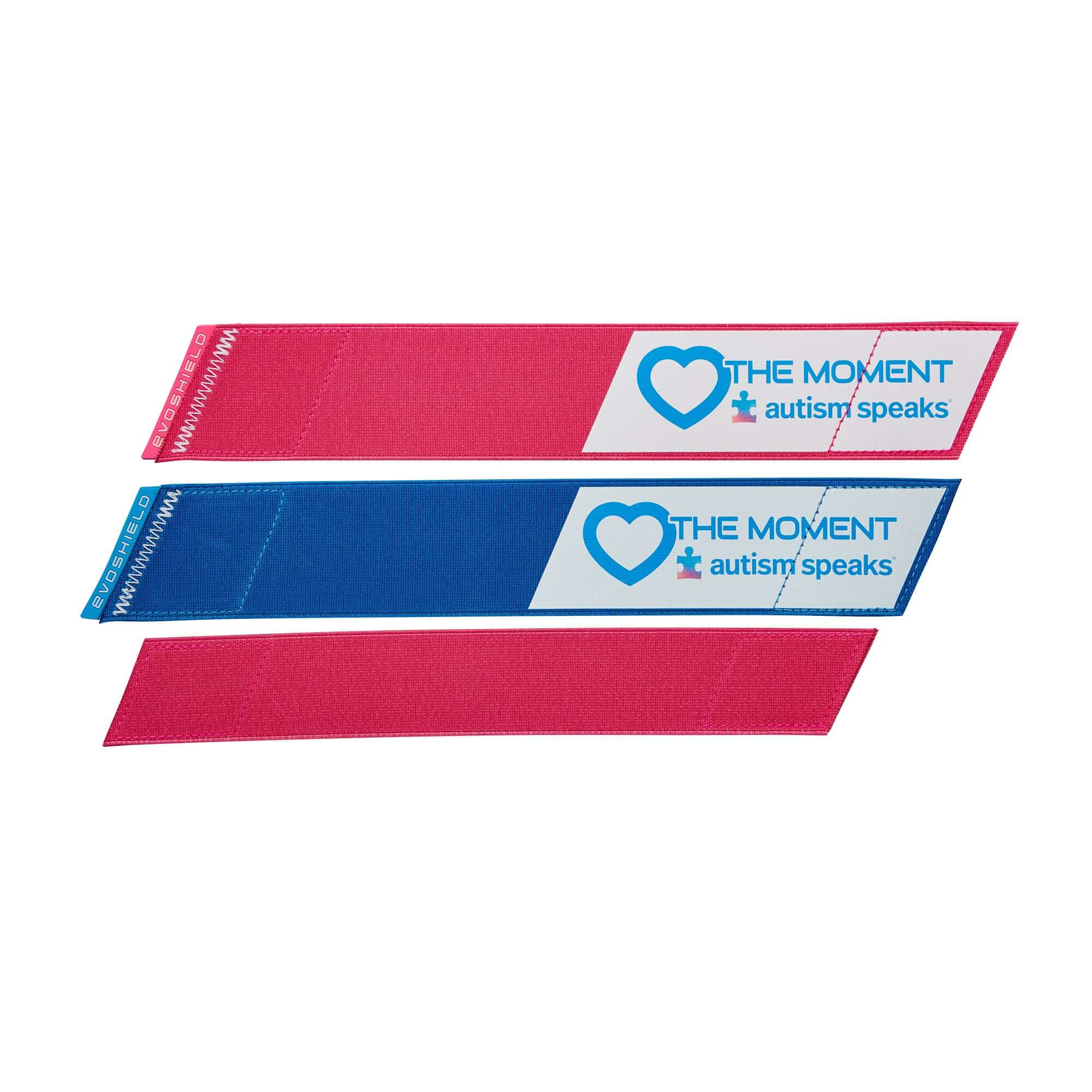 Pink and blue leg guard straps with "Love the Moment" and Autism Speaks logos for baseball and softball.