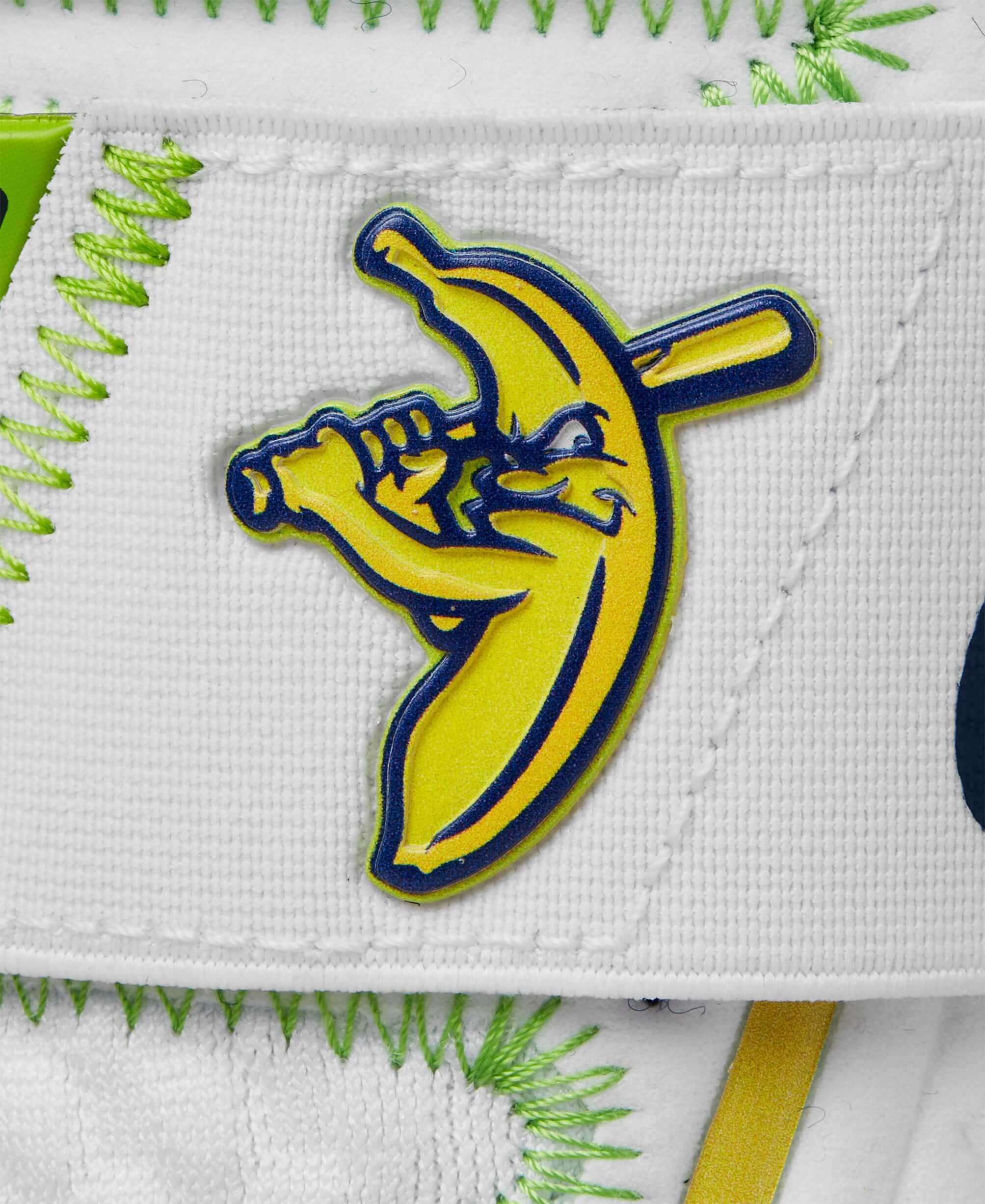 Savannah Bananas logo featuring a banana character holding a baseball bat on a white background.