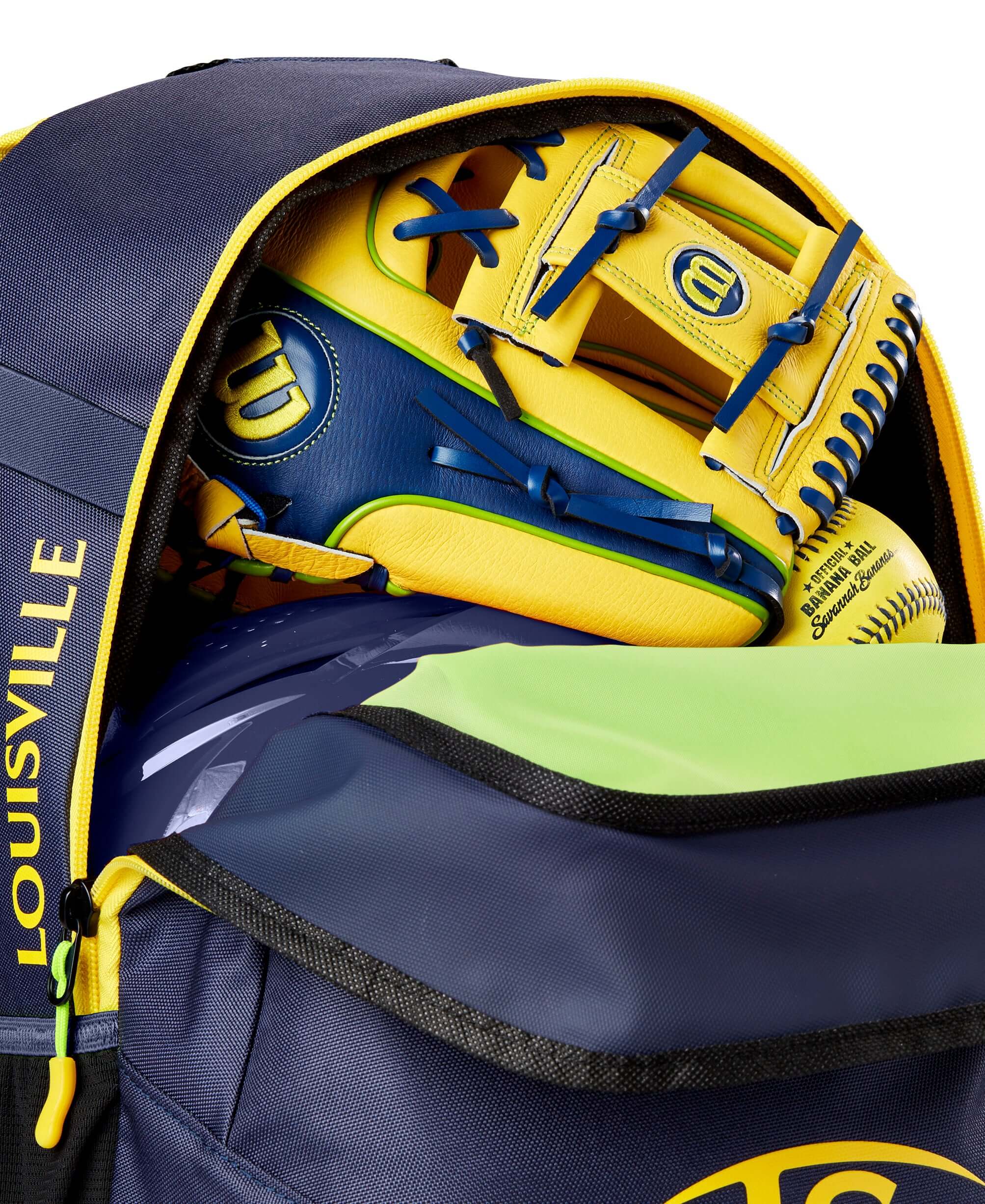 Louisville Slugger Bananas Powerized Stick Pack open view showing spacious main compartment for helmet glove shoes