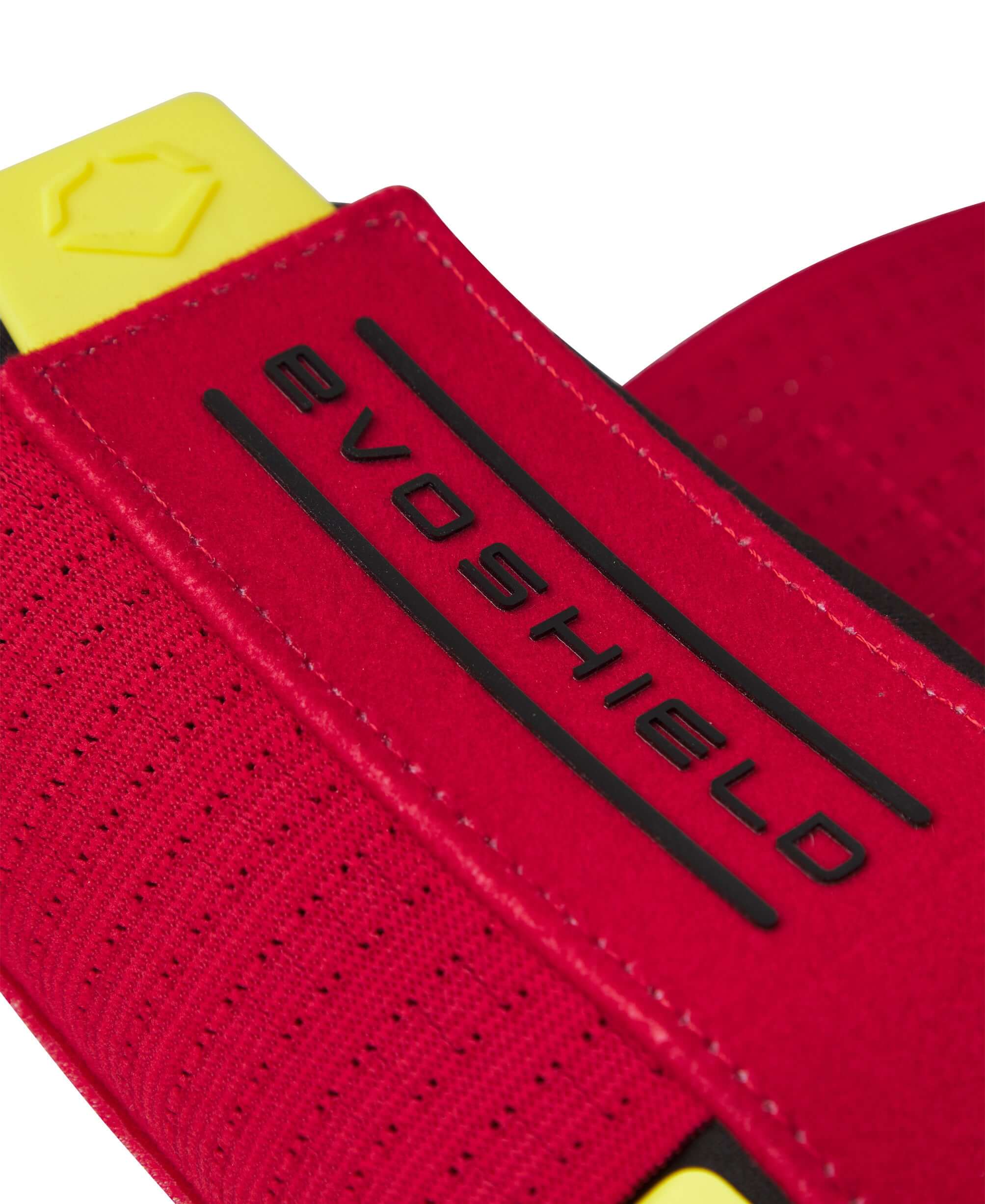 Close-up of the Evoshield X-SRZ Stay Hot Sliding Mitt 2.0 strap showcasing red and yellow design with branded logo.