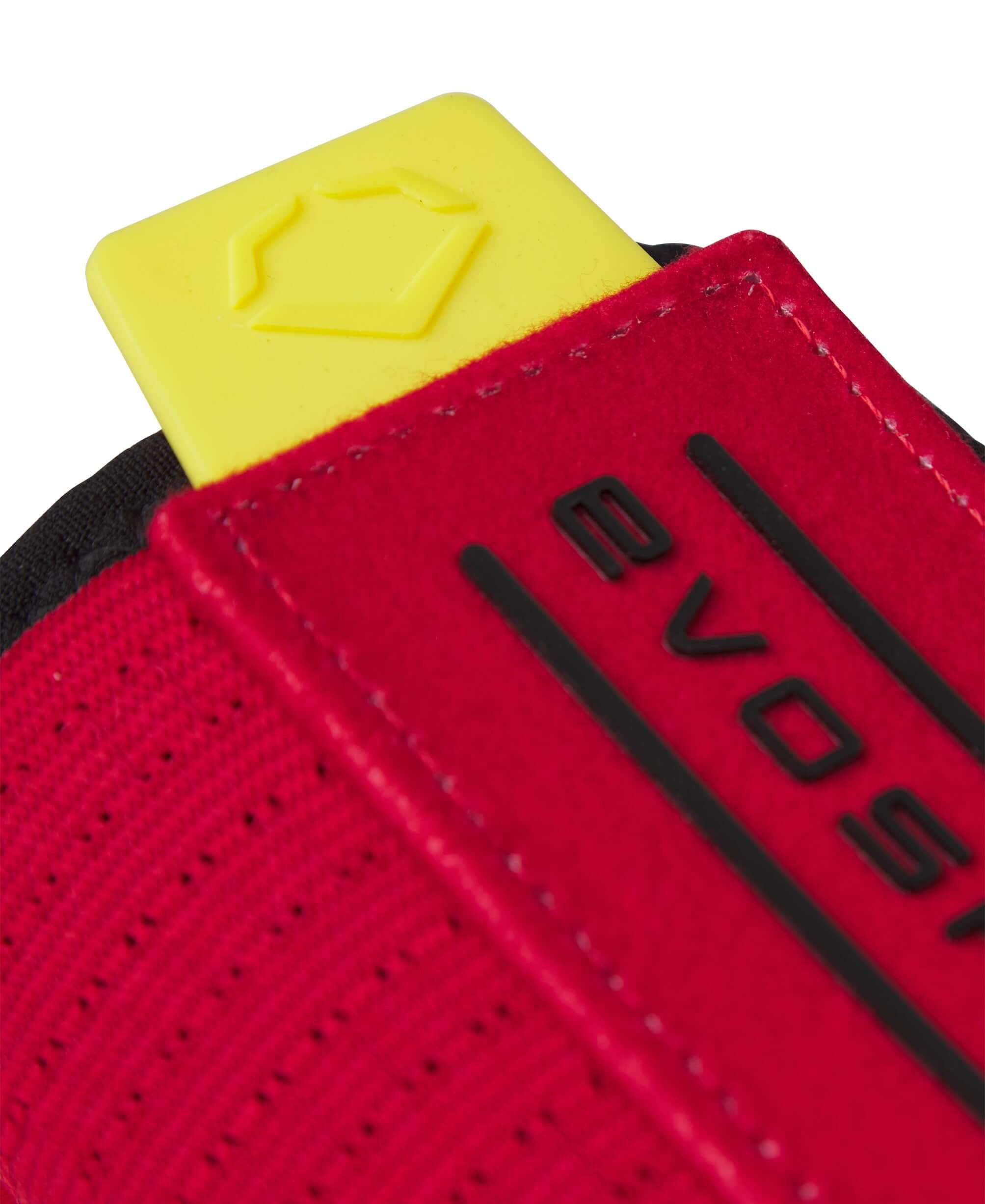 Close-up of the Evoshield X-SRZ Stay Hot Sliding Mitt 2.0 featuring a red design with a yellow tab for easy adjustment.