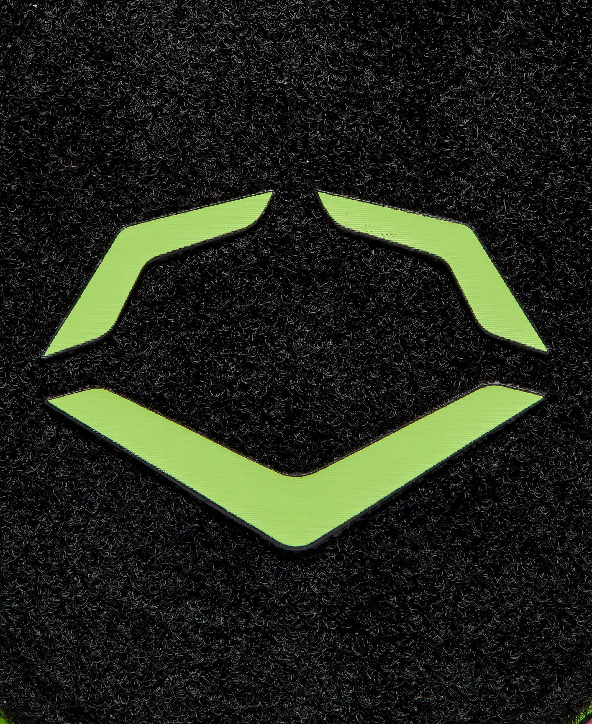 Close-up of EvoShield logo in neon green on a black background, showcasing its sleek design.